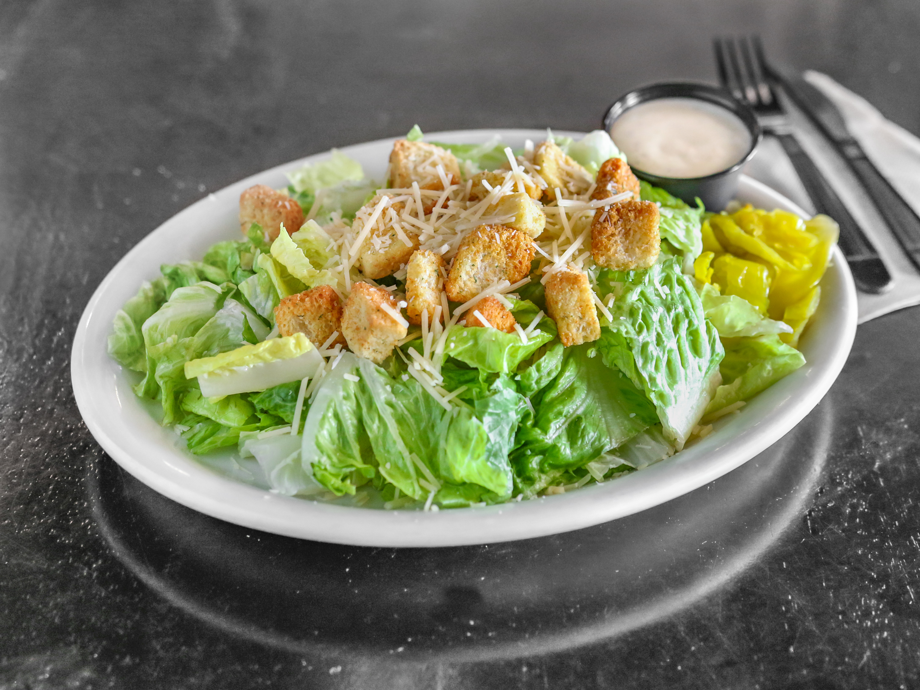 Order Caesar Salad food online from Cosentino's Pizza store, San Clemente on bringmethat.com