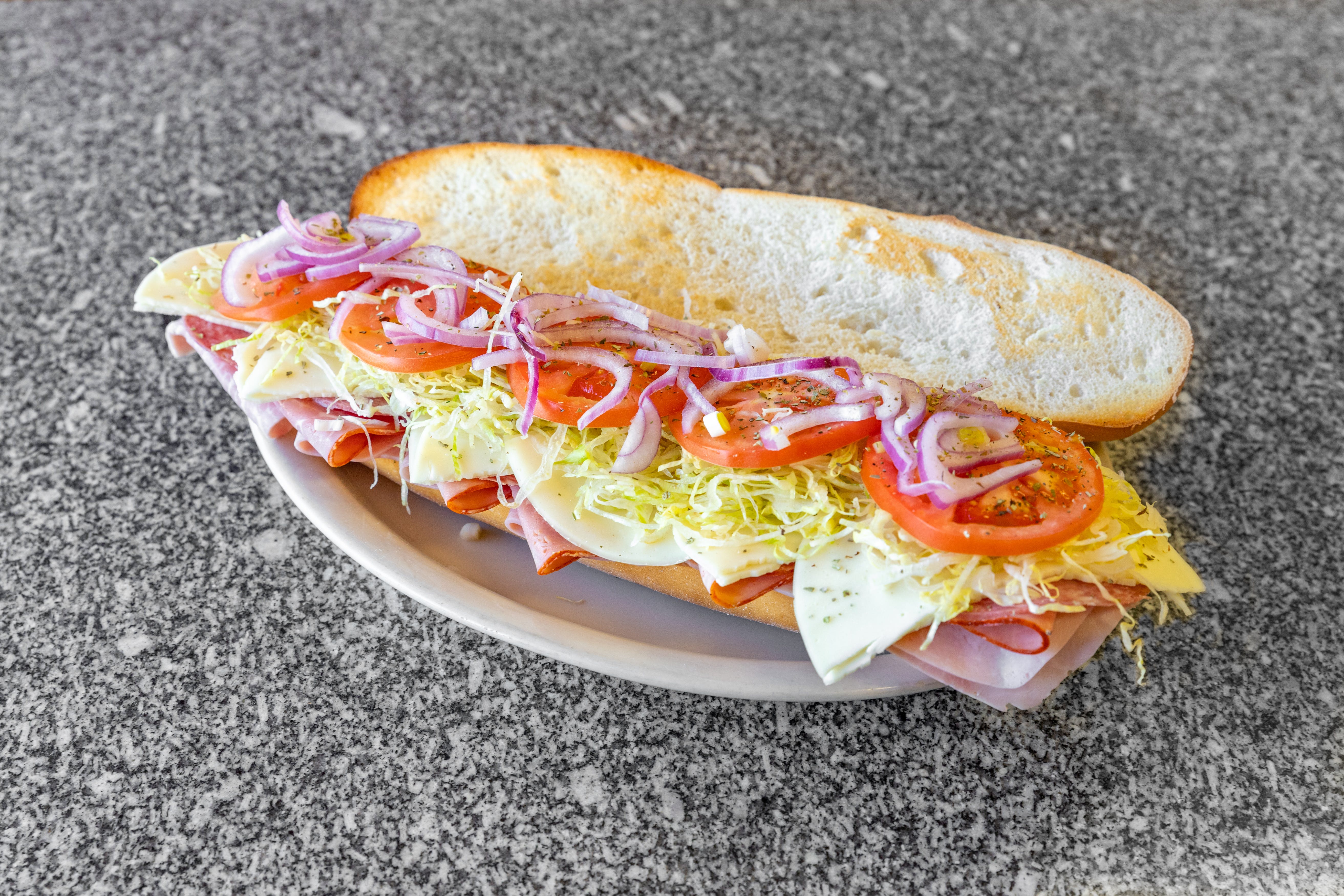 Order Italian Cold Sub - Half 8'' food online from Dominick's Pizza Shoppe store, Clinton on bringmethat.com