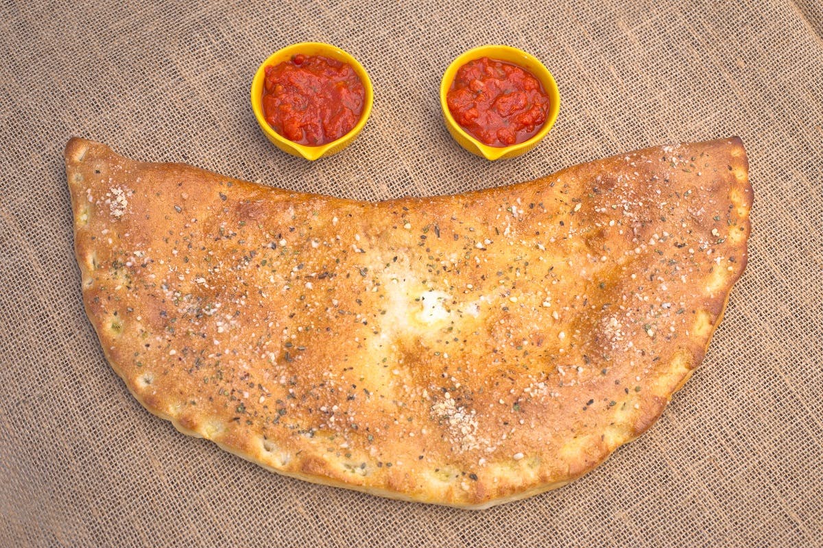Order Giant Cheese Calzone - Calzone food online from La Casa De Pizzeria store, Troy on bringmethat.com