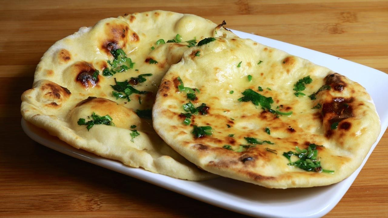 Order Butter Naan food online from Swad Indian and Nepalese Cousine store, Fort Worth on bringmethat.com