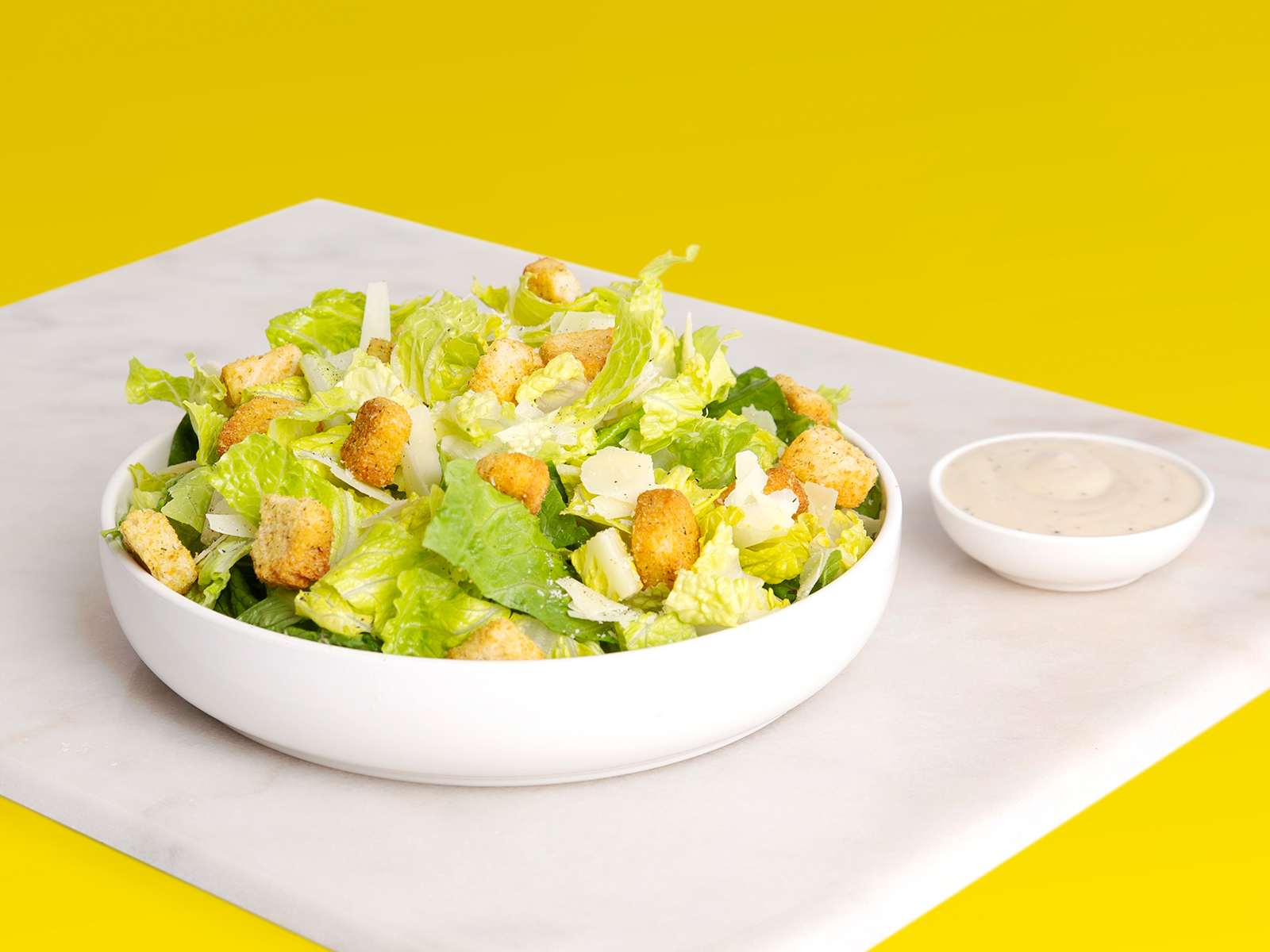 Order Caesar Salad food online from The Pizza Joint store, San Diego on bringmethat.com