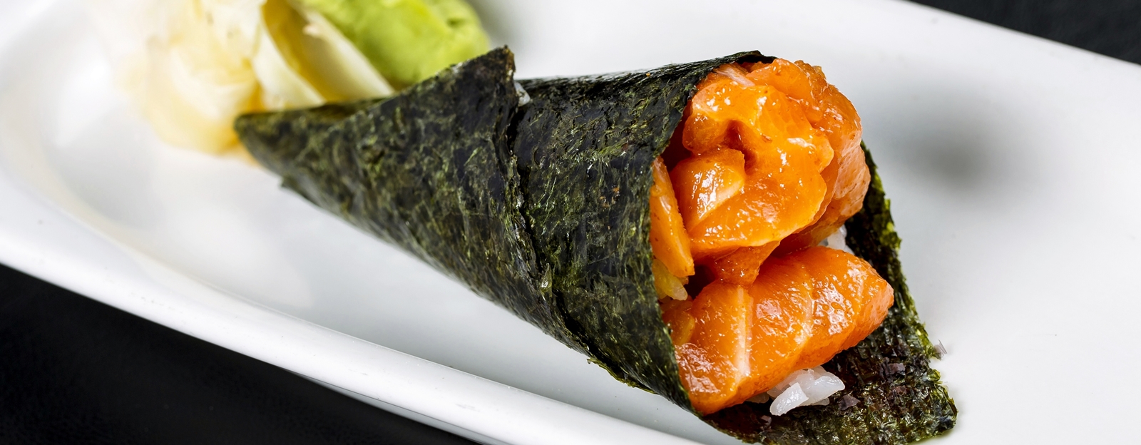 Order Spicy Salmon Hand Roll food online from PB Sushi store, San Diego on bringmethat.com