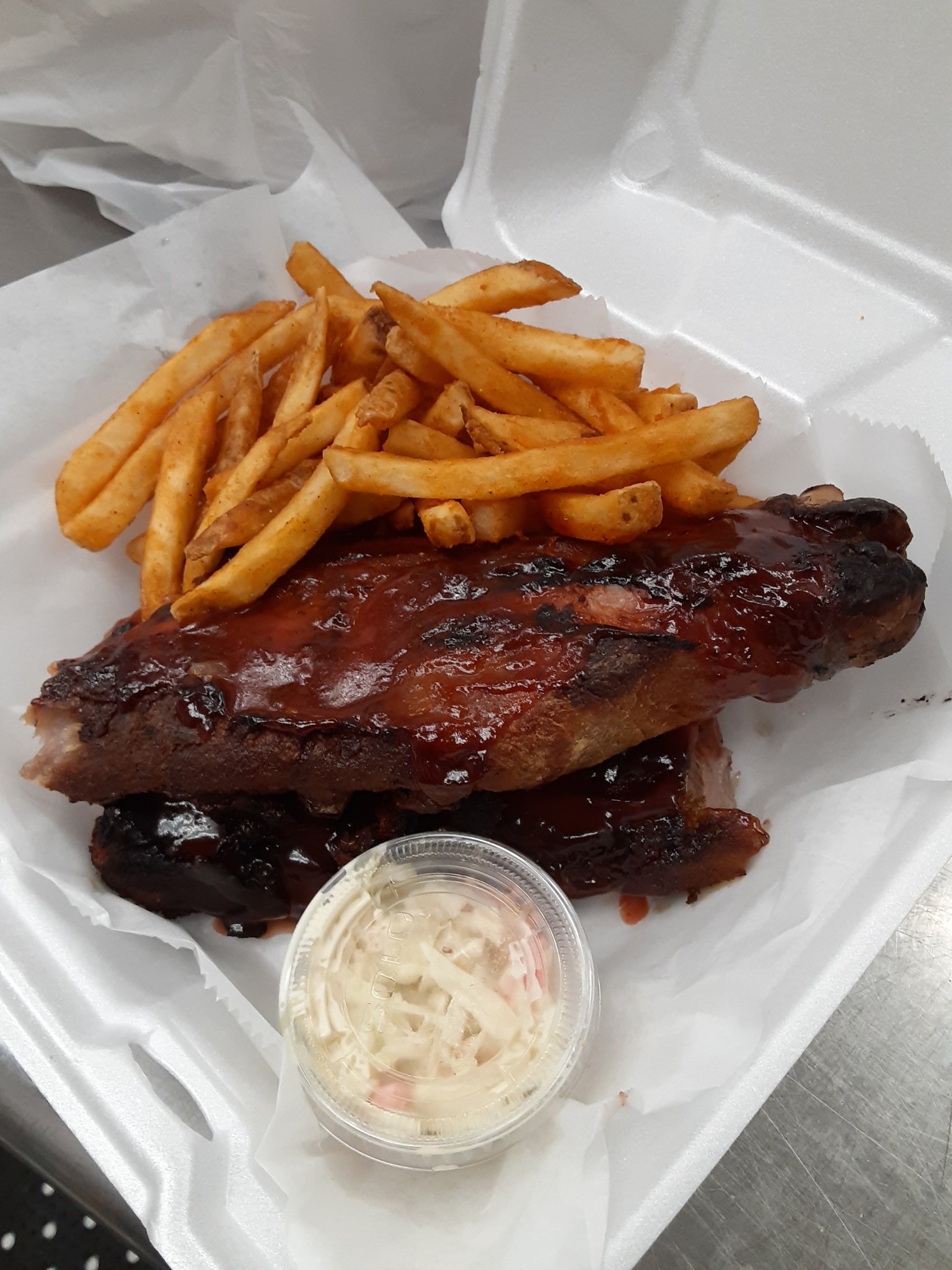 Order Full Slab of Babyback BBQ Ribs food online from 1st Place Sports Bar store, Hoffman Estates on bringmethat.com