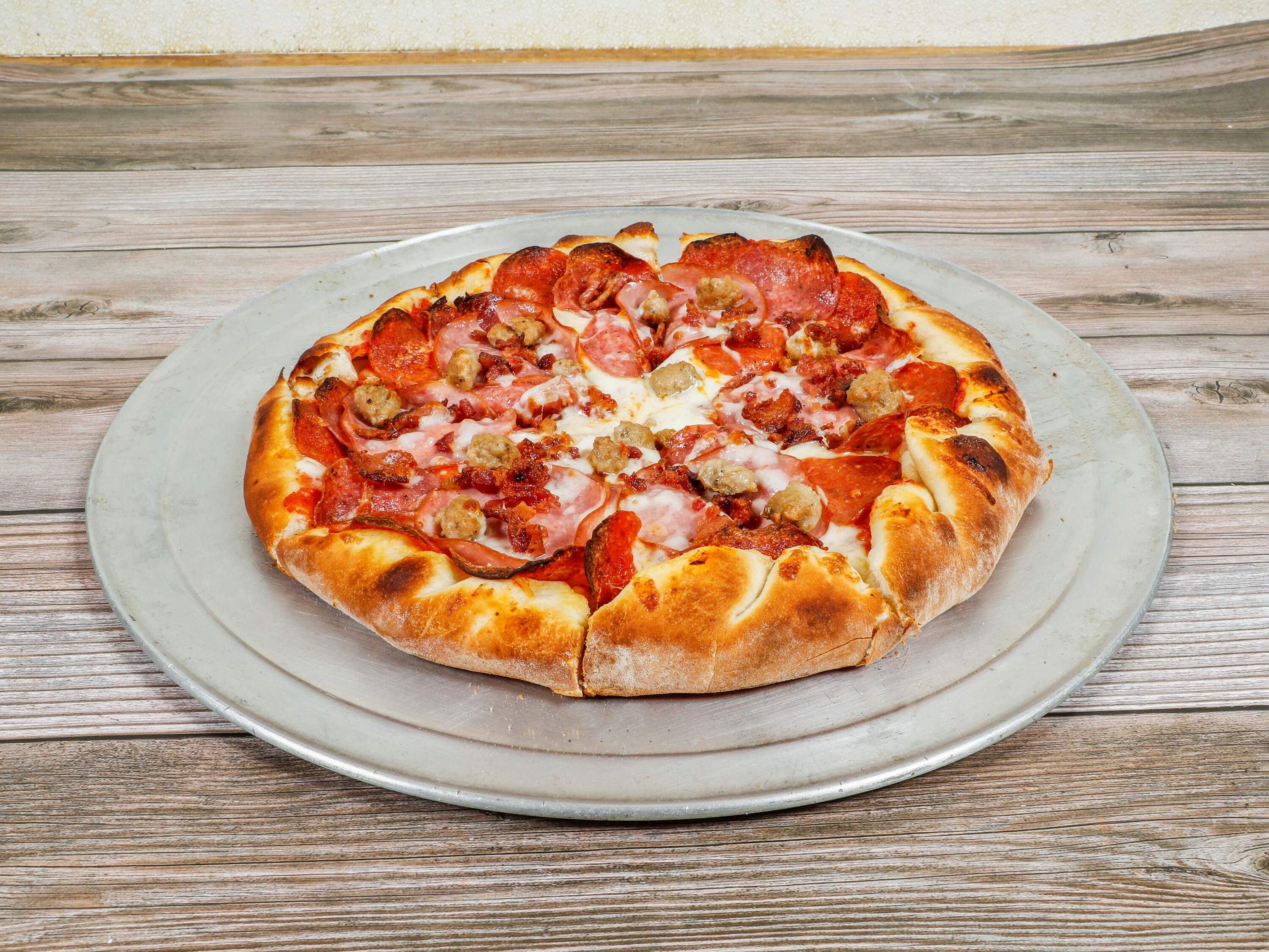 Order Manly Meat Lovers Pizza food online from Luigis Pizza store, Modesto on bringmethat.com