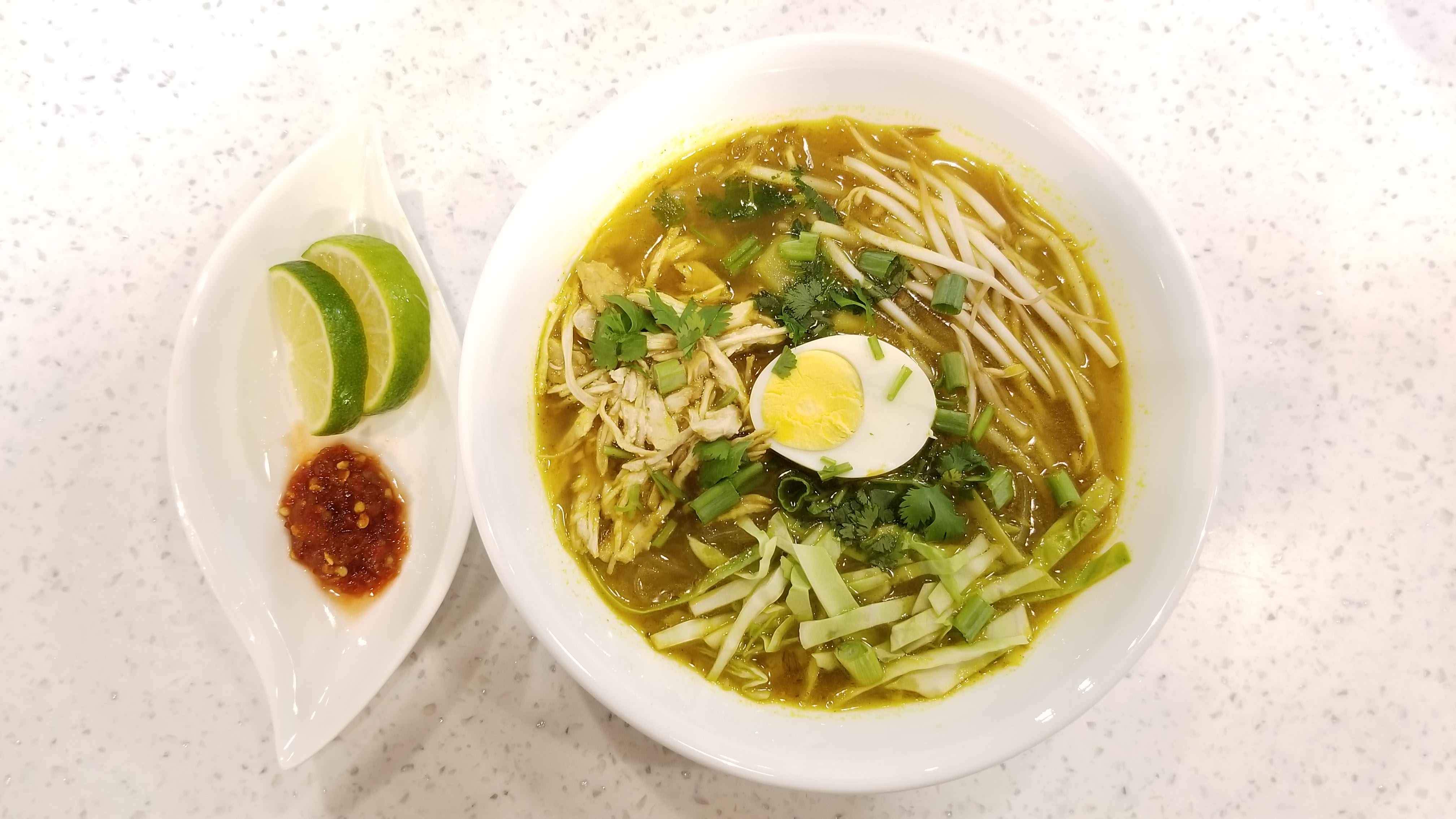 Order Yellow Chicken Soup ( Soto Ayam ) food online from Café Bali store, Bloomington on bringmethat.com