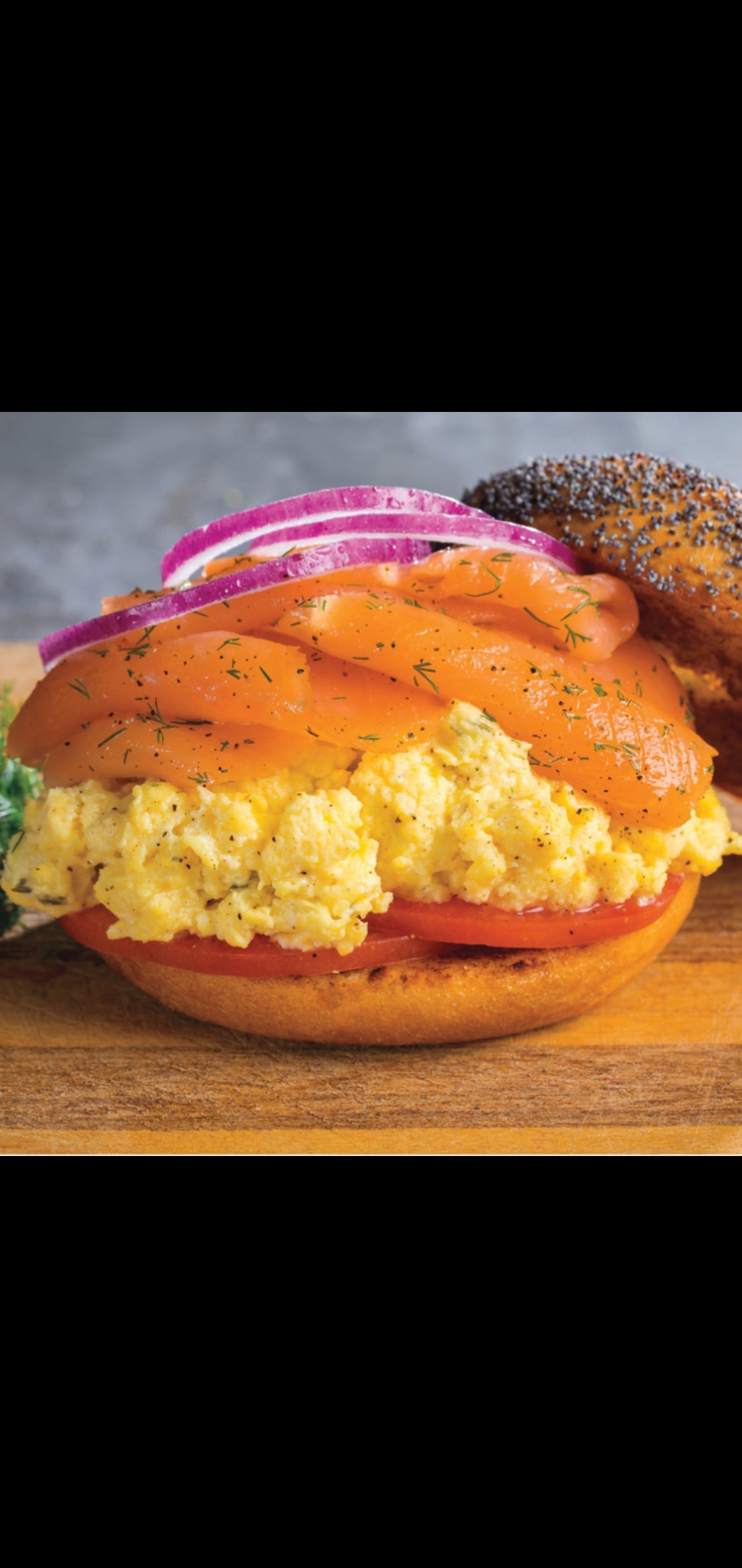Order Scrambled Eggs Smoked Salmon Red Onions & Tomatoes Sandwich  food online from American Gourmet Foods Deli store, New York on bringmethat.com