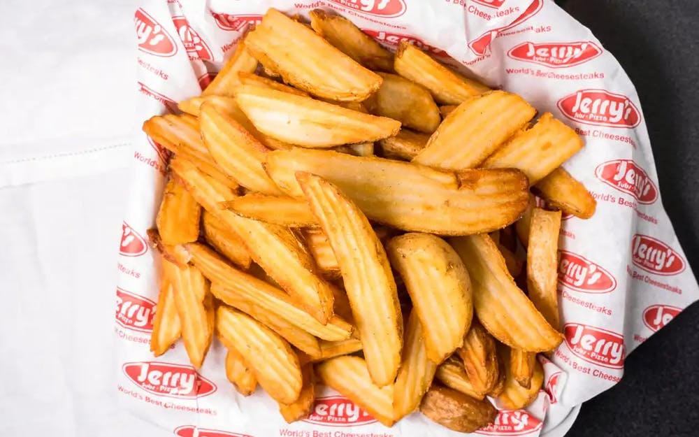 Order Jerry's Famous Wedge Fries - Regular food online from Jerry's Subs & Pizza store, Dunkirk on bringmethat.com
