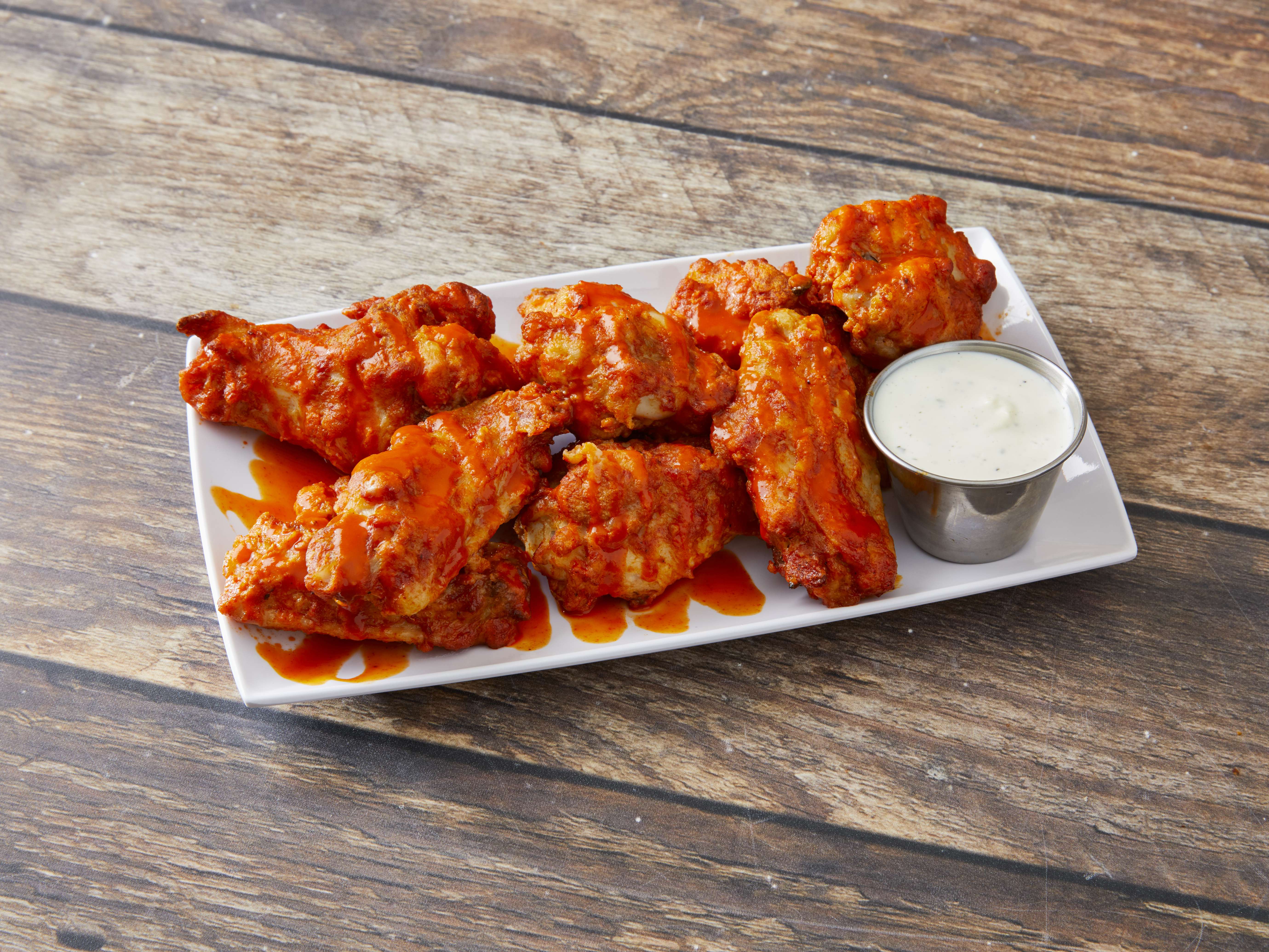 Order Spicy and Baked Buffalo Wings food online from The Burger Movement store, Royal Oak on bringmethat.com