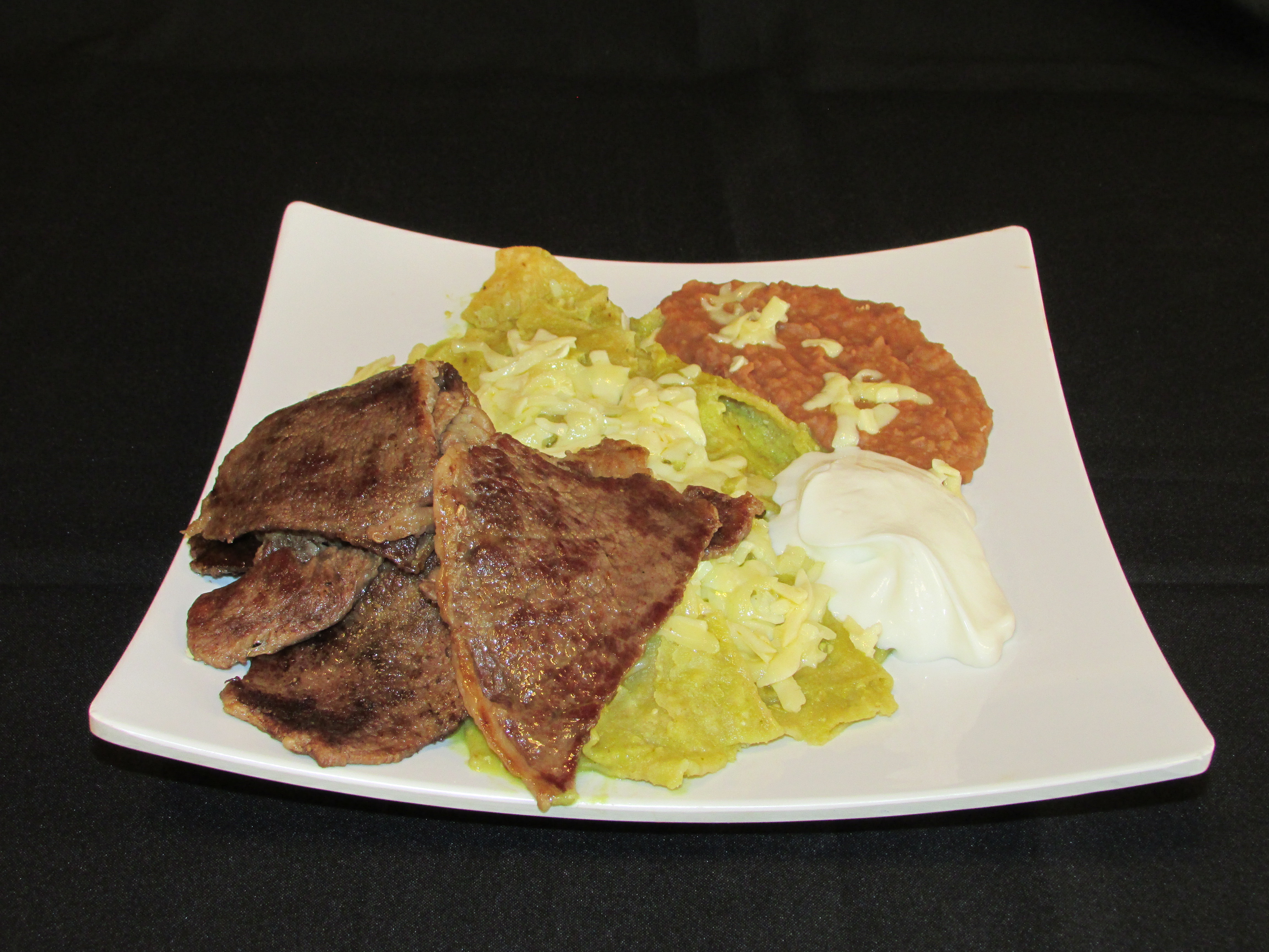 Order Chilaquiles con Bistek food online from Taqueria Los Flacos store, Chicago on bringmethat.com