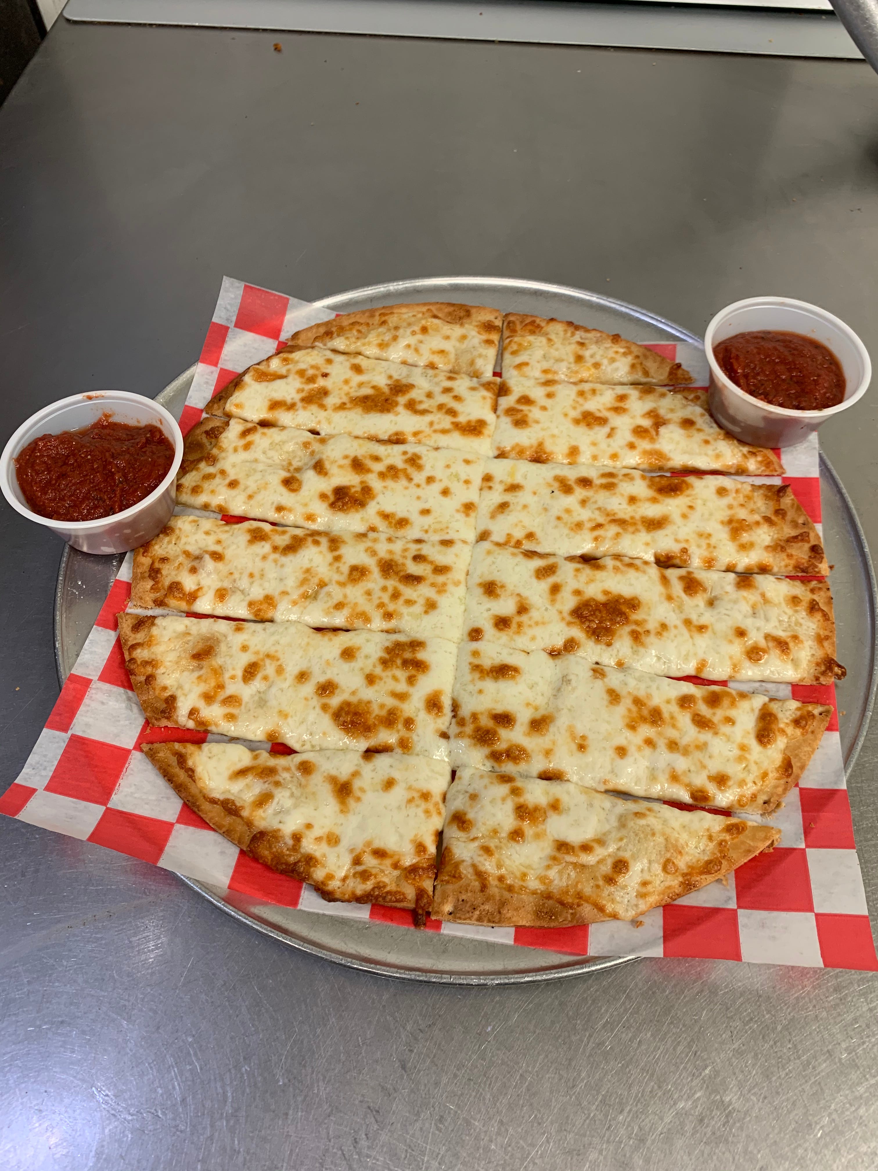 Order Cheesy Garlic Sticks - 12 Pieces food online from Jimmy's Pizza store, Cold Spring on bringmethat.com