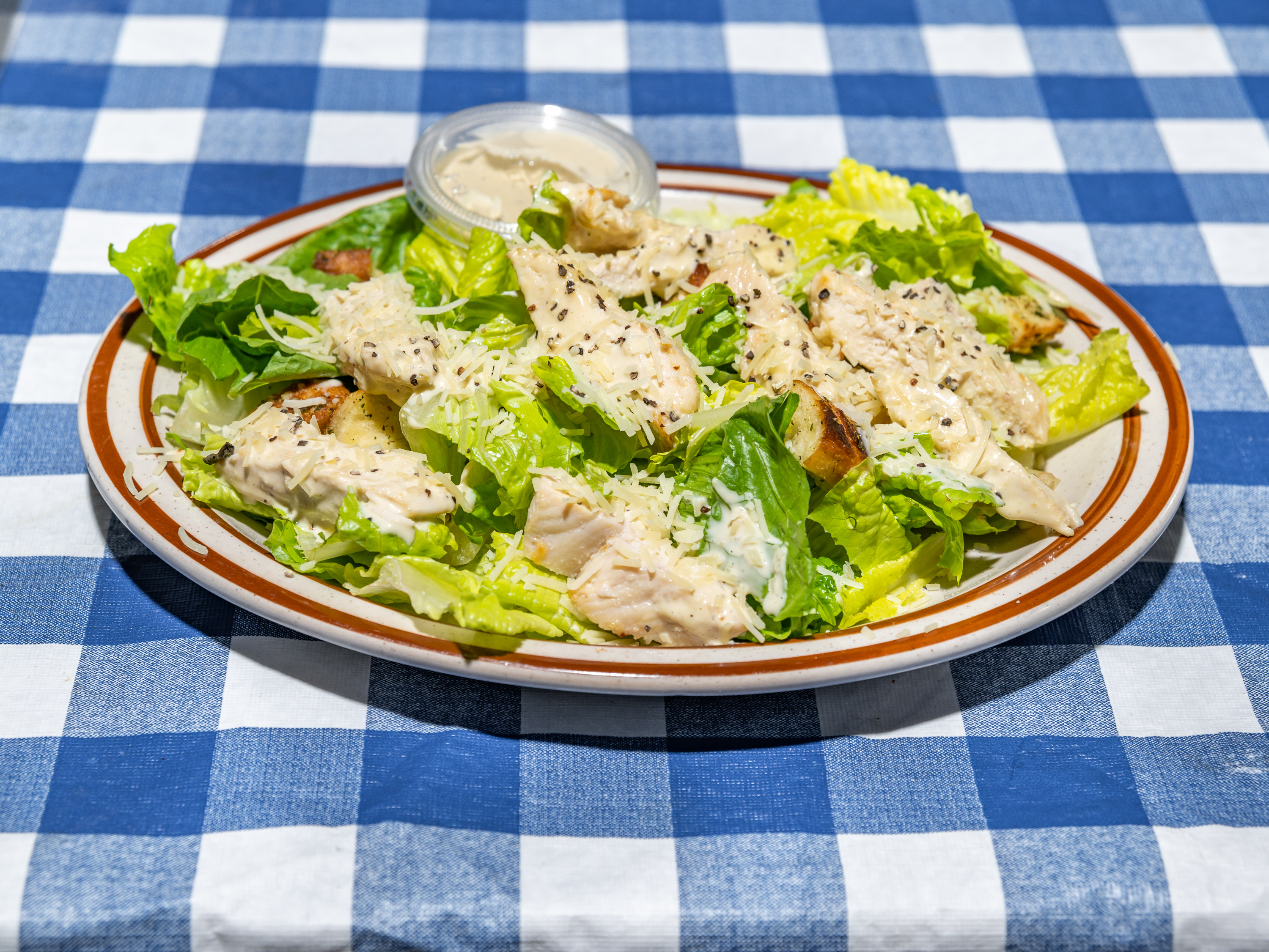 Order Chicken Caesar Salad food online from Topolino's Pizza store, Seattle on bringmethat.com