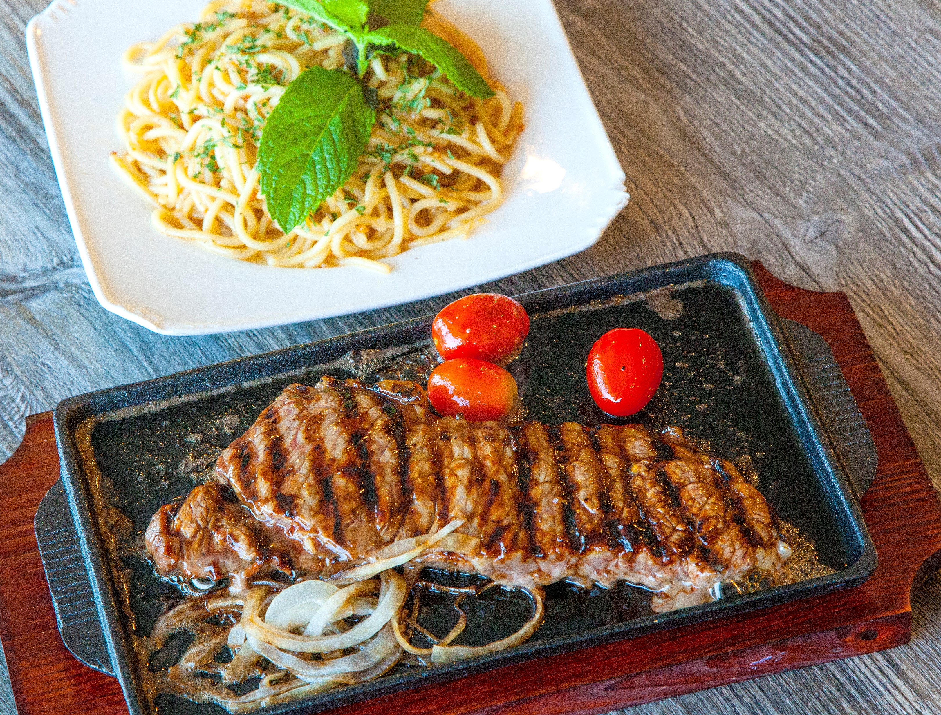 Order Sizzling NY Steak food online from Pho Tick Tock store, San Jose on bringmethat.com
