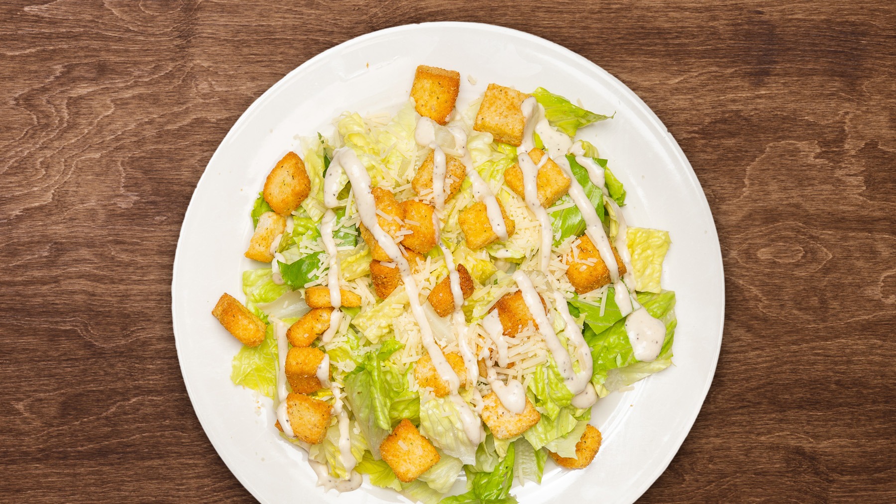 Order Large Caesar Salad 
 food online from The Green Olive store, Ventura on bringmethat.com