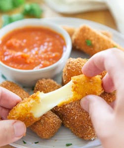 Order Mozzarella Sticks food online from Krispy Krunchy Chicken store, Irving on bringmethat.com