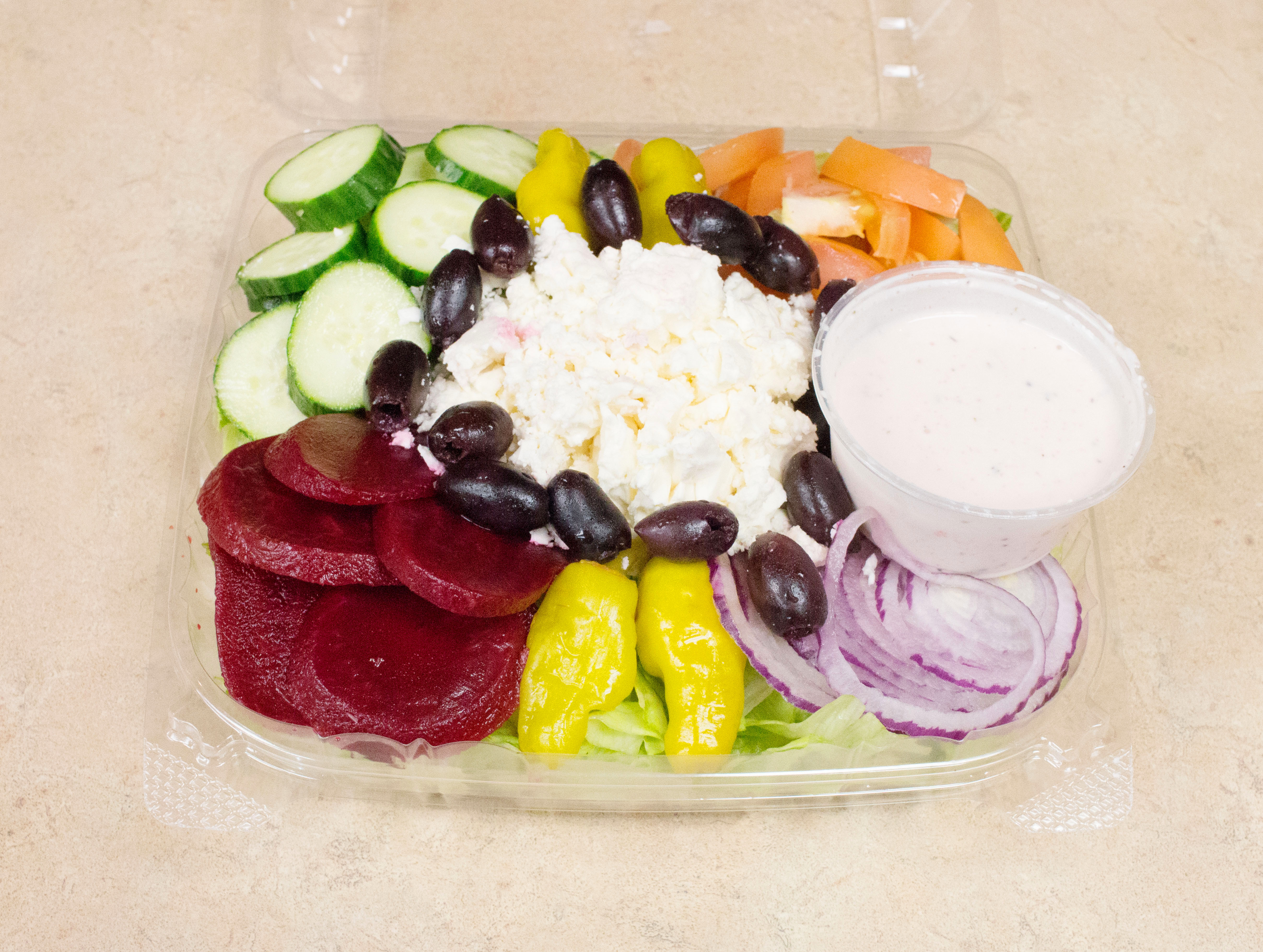 Order Greek Salad food online from Grapes And Hops Market store, Waterford on bringmethat.com