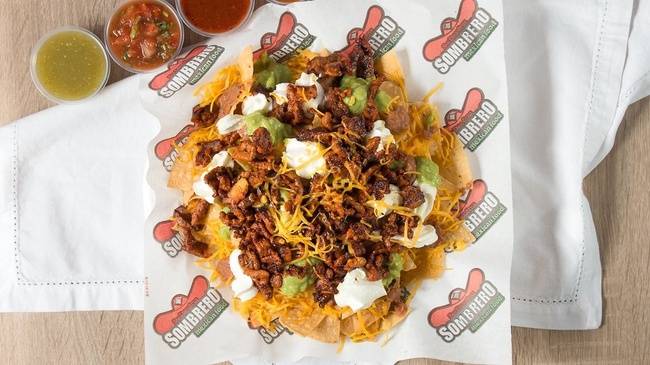 Order Nachos Supreme-Full food online from Sombrero Mexican Food store, San Diego on bringmethat.com