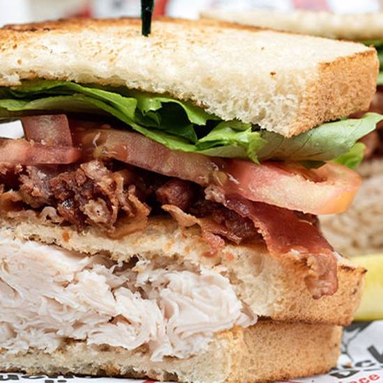 Order *Bacon & Turkey Club food online from Groucho Deli store, Charleston on bringmethat.com