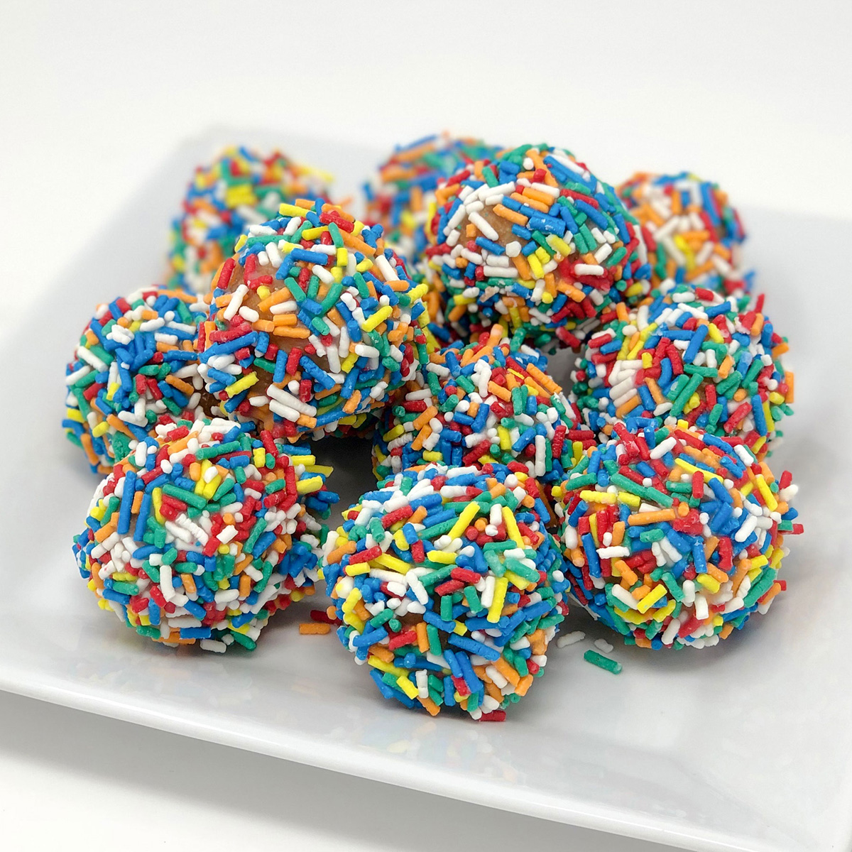 Order Dozen Donut Holes, Sprinkles food online from Merritt's Bakery  store, Tulsa on bringmethat.com