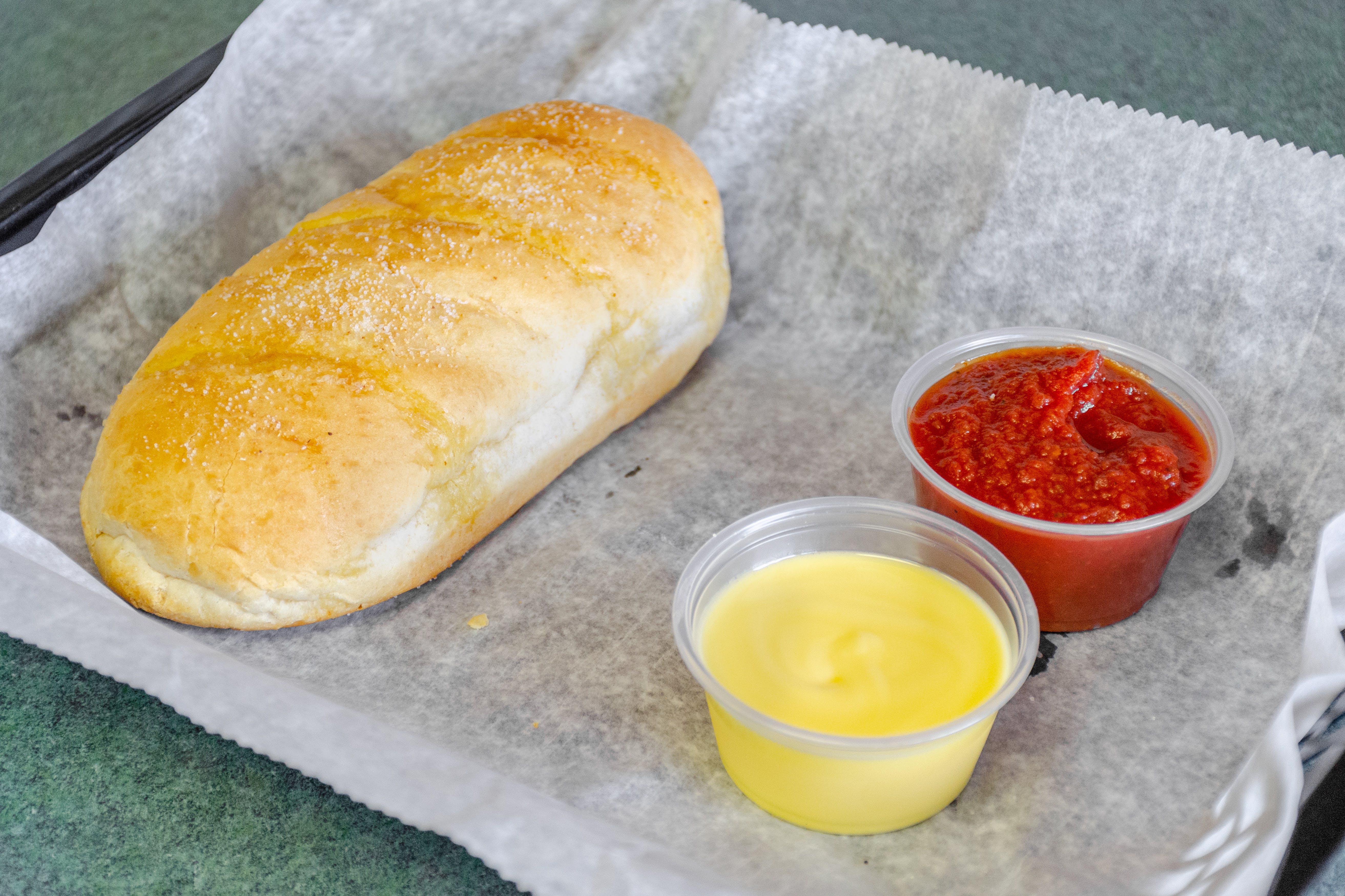 Order Garlic Loaf - Small food online from Saucy Sisters Pizzeria store, Leesburg on bringmethat.com