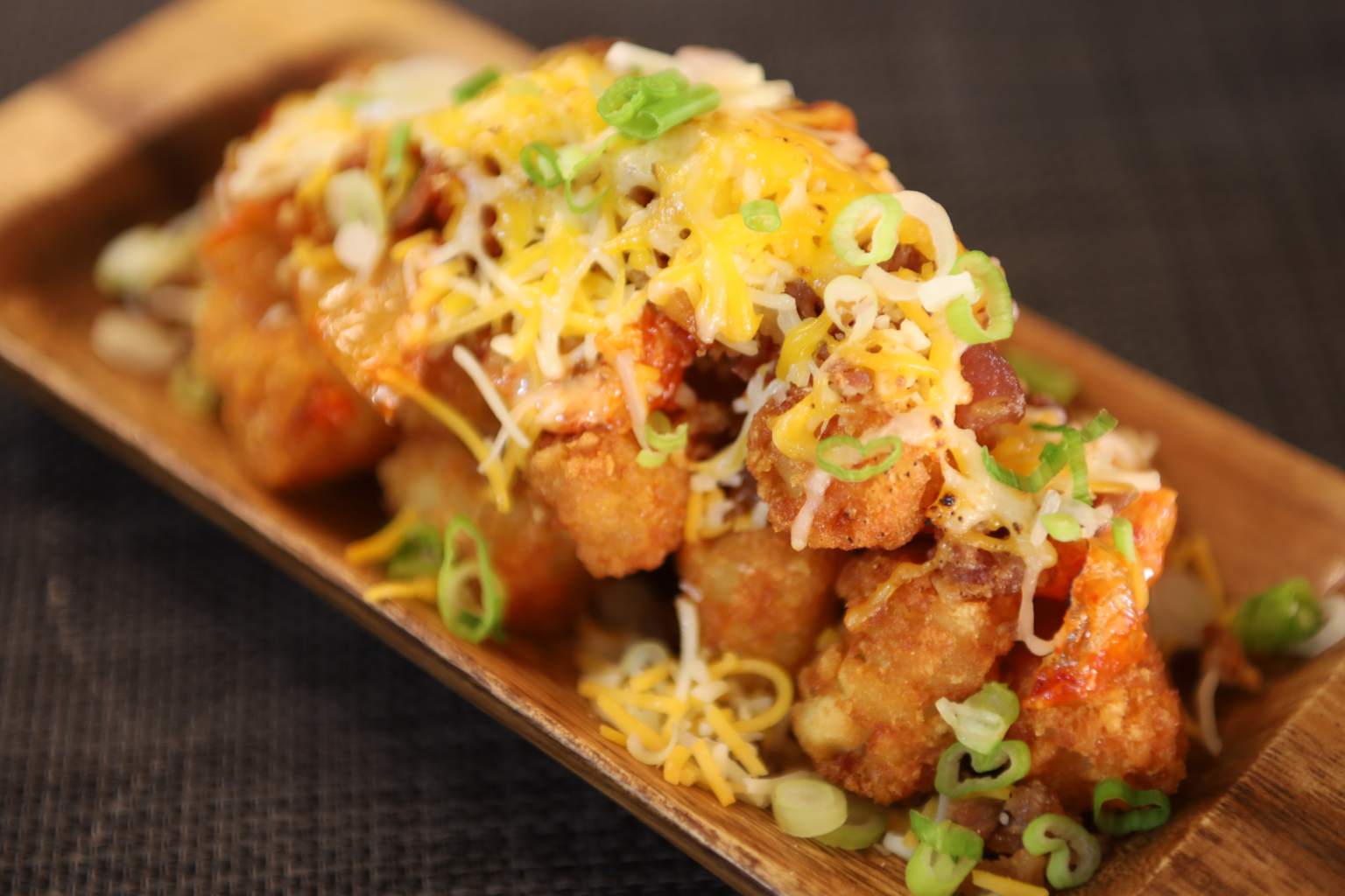 Order Cheesy Bacon Kimchi Tater Tots food online from Maejoo Wings store, San Leandro on bringmethat.com