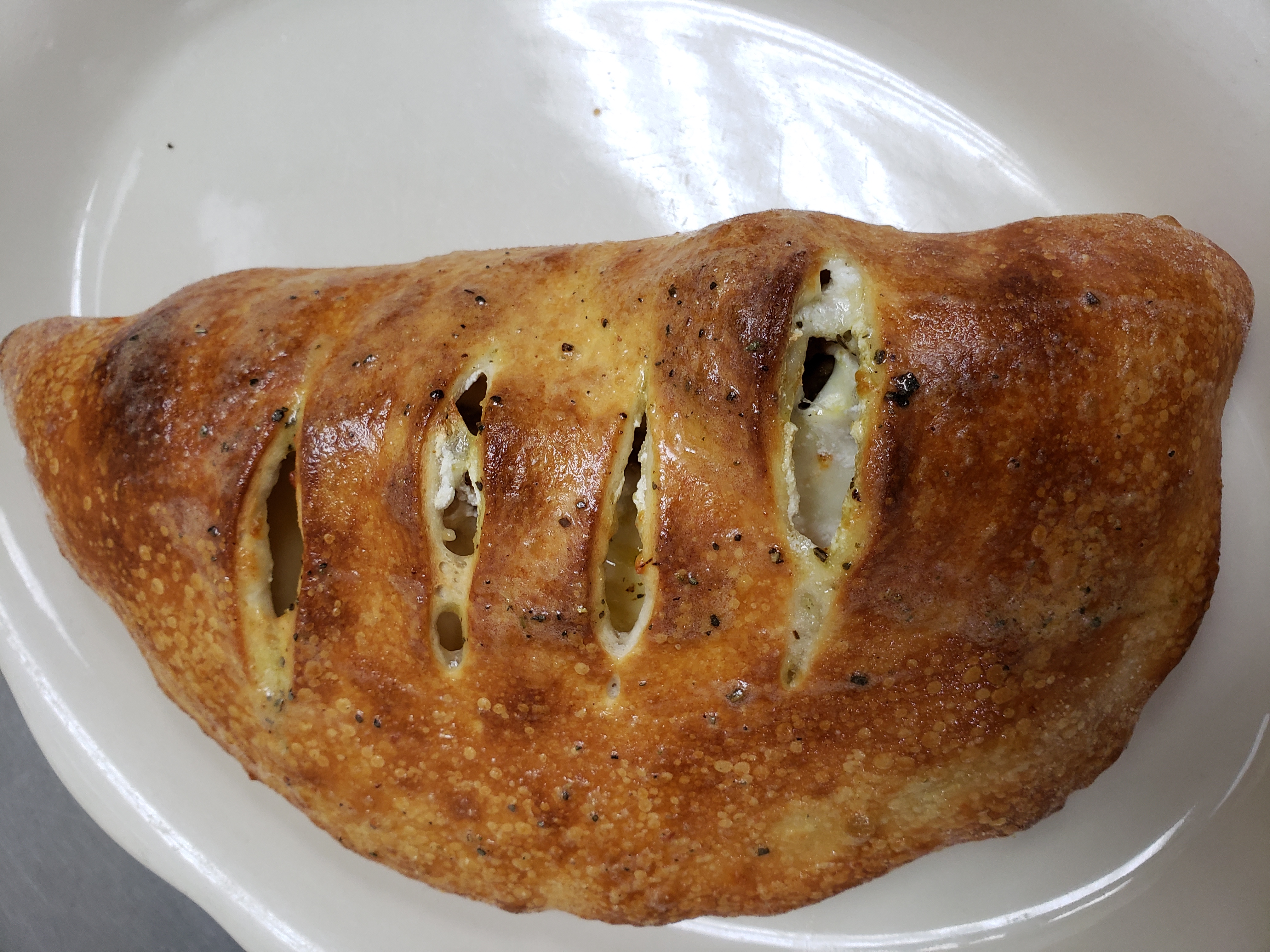Order Italian Calzone food online from Illianos Pizza store, Clemmons on bringmethat.com