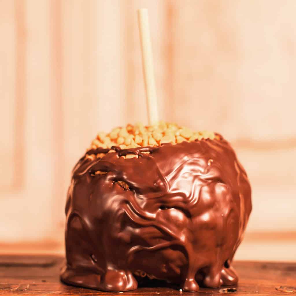 Order Peanut Butter Chip Caramel Apple Covered in Dark Chocolate food online from Candy Apple Shoppe store, Glenwood on bringmethat.com