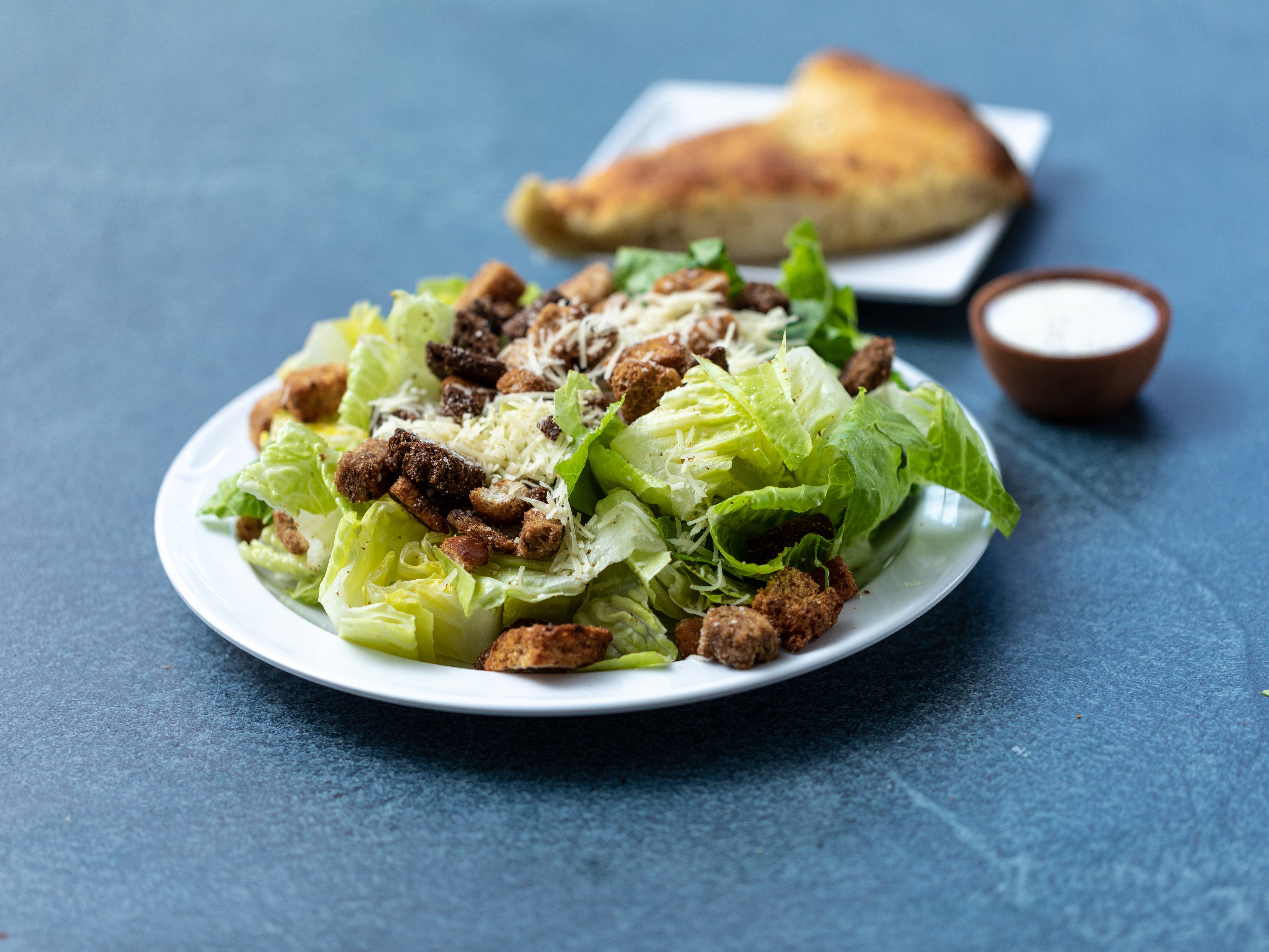 Order Caesar Salad food online from Supreme Pizza store, Boston on bringmethat.com