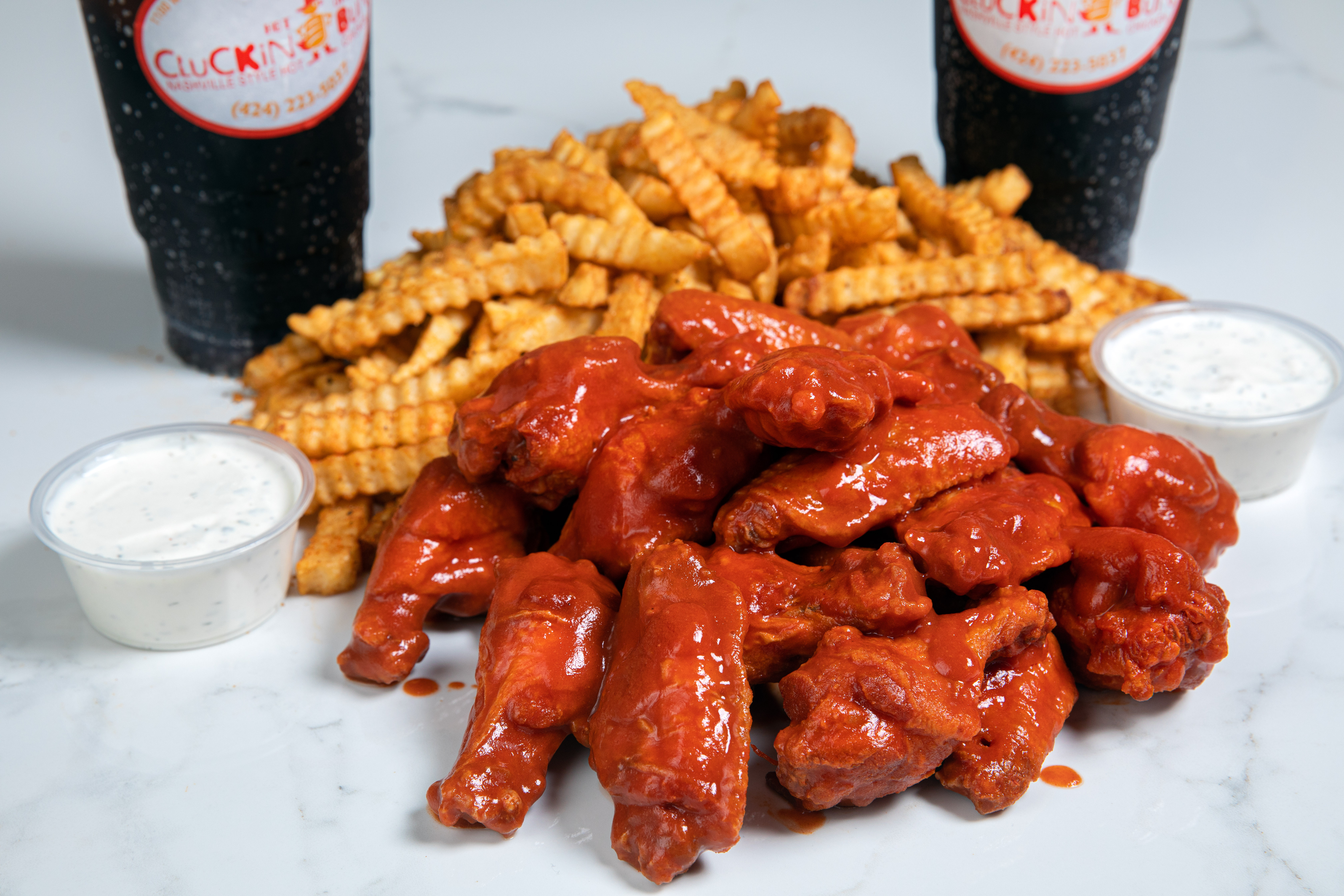 Order Wingin Clucker • 20pc food online from Cluckin Bun store, cathedral city on bringmethat.com