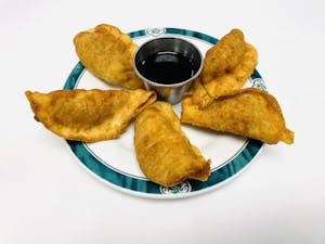Order 11. Fried or Steamed Dumplings (5) food online from Lido Restaurant store, Oklahoma City on bringmethat.com