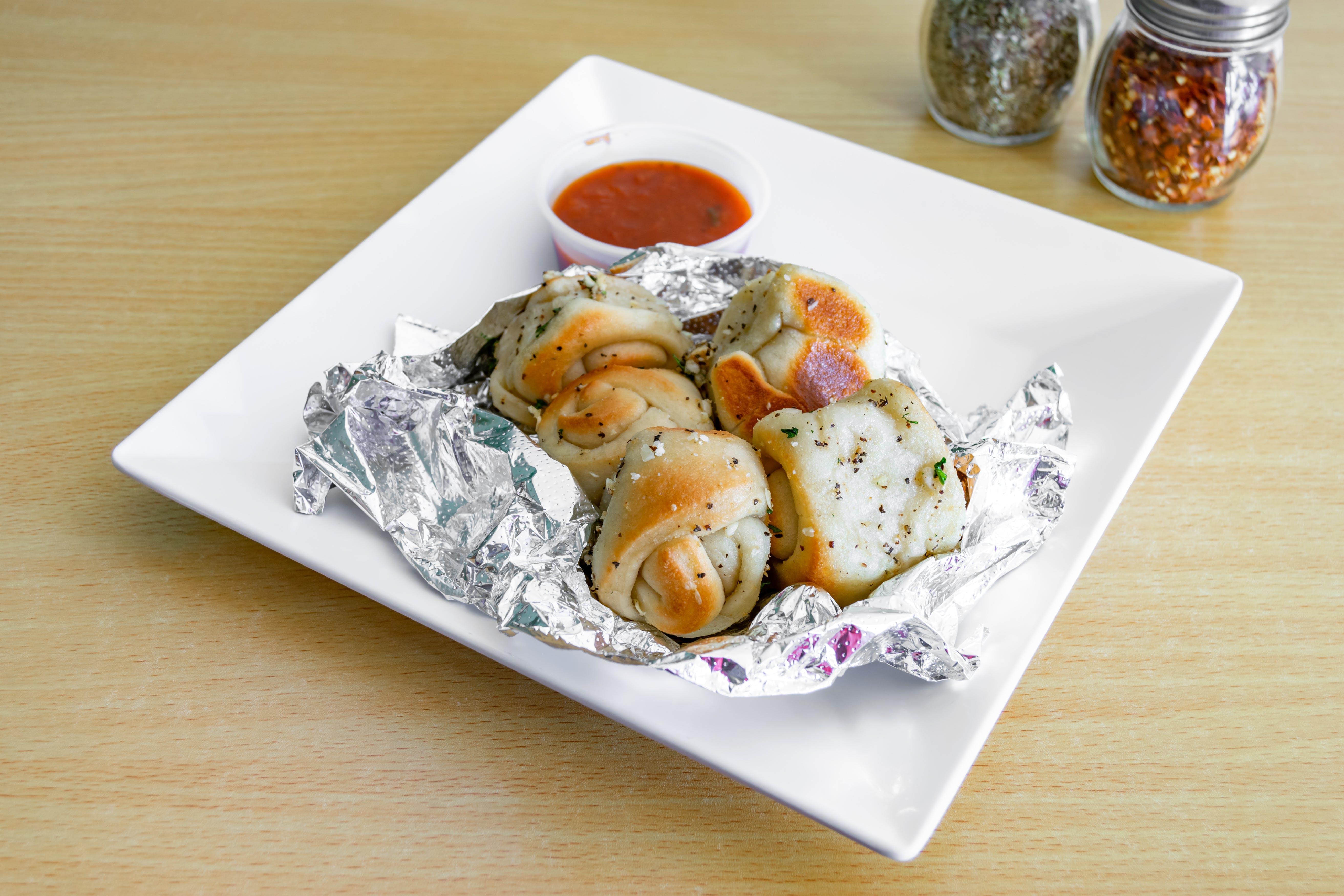 Order Garlic Knots - 5 Pieces food online from Dolce Pizza store, East Orange on bringmethat.com