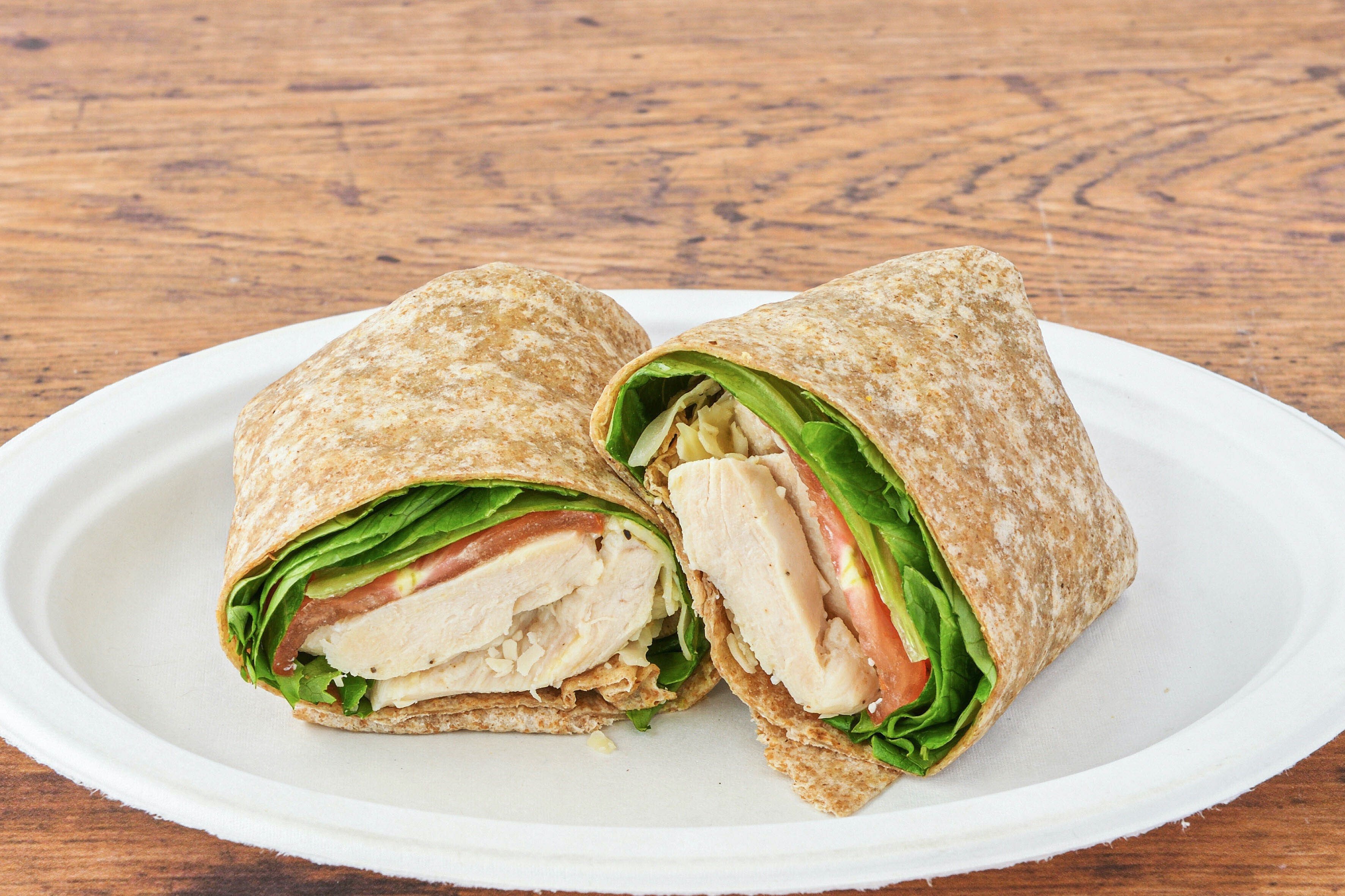 Order Grilled Chicken Caesar Wrap Sandwich food online from Manhattan Bagel store, Westfield on bringmethat.com