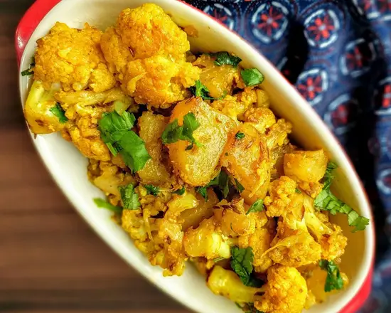 Order Aloo Gobhi food online from Incredible India Cafe store, Los Angeles on bringmethat.com