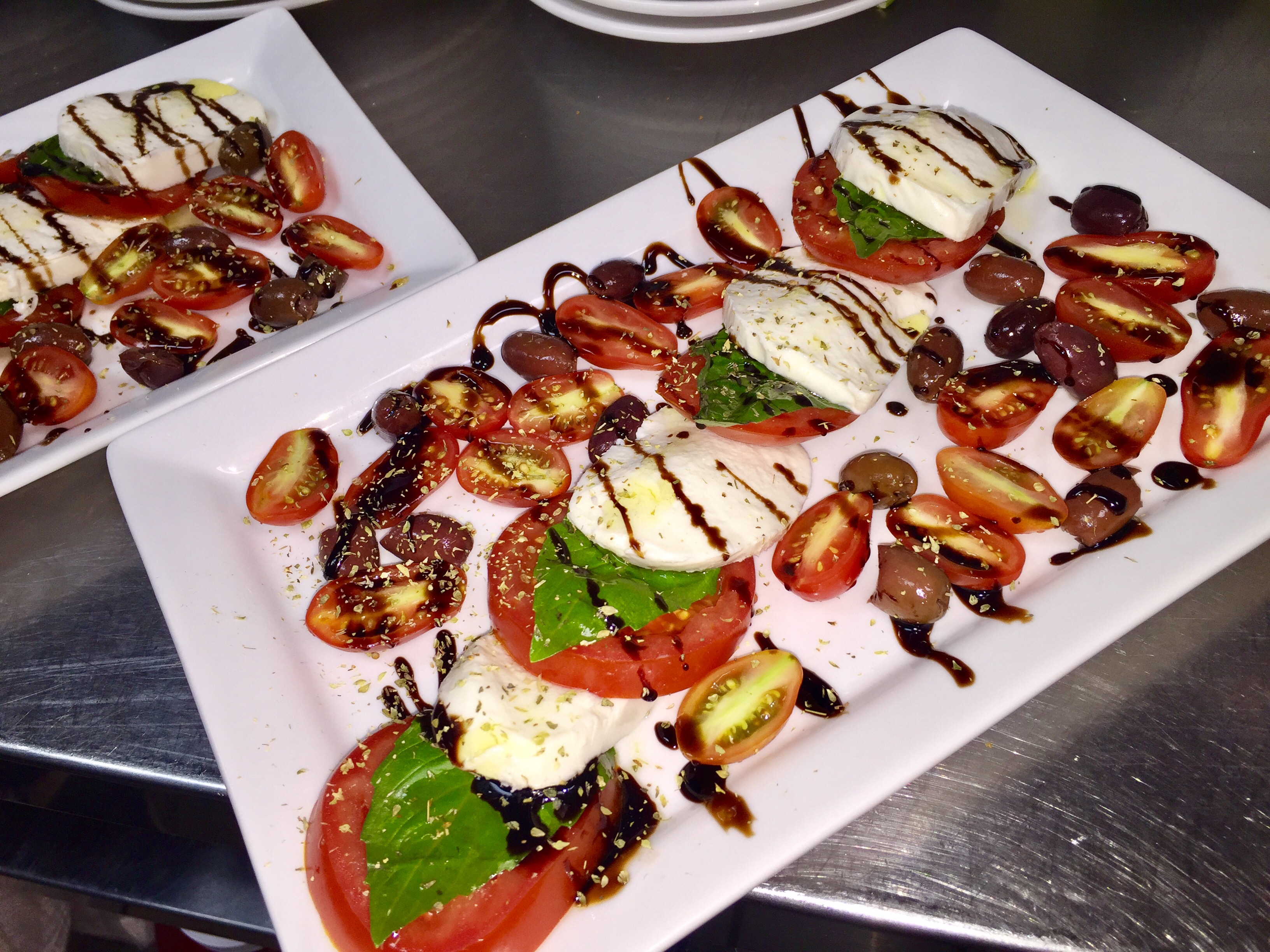 Order Caprese Salad food online from Shakers Bar and Grill store, Wixom on bringmethat.com