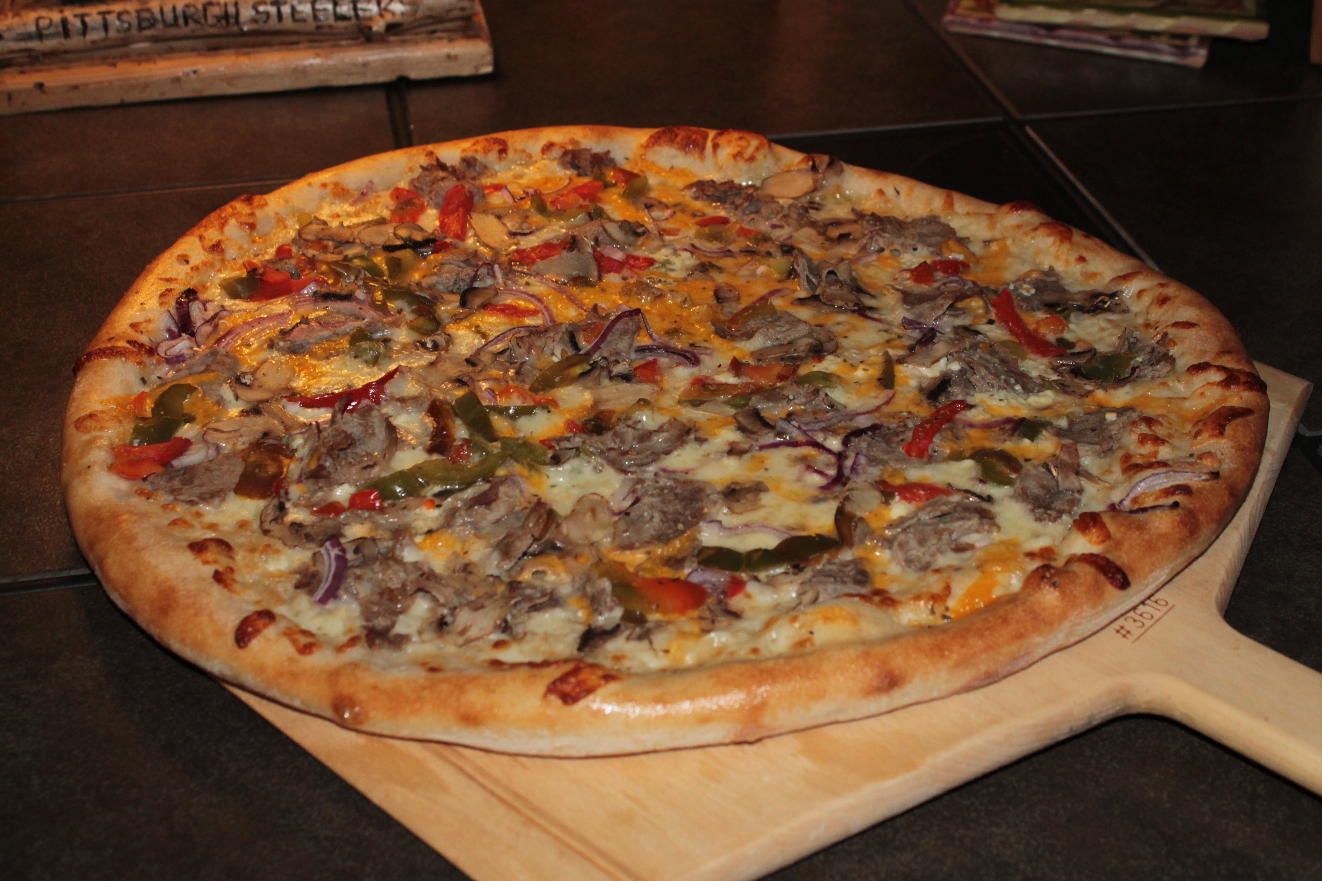 Order Philly Cheese Steak Pizza - Medium 14" food online from The Dough Boy's Pizzeria store, Baldwinsville on bringmethat.com