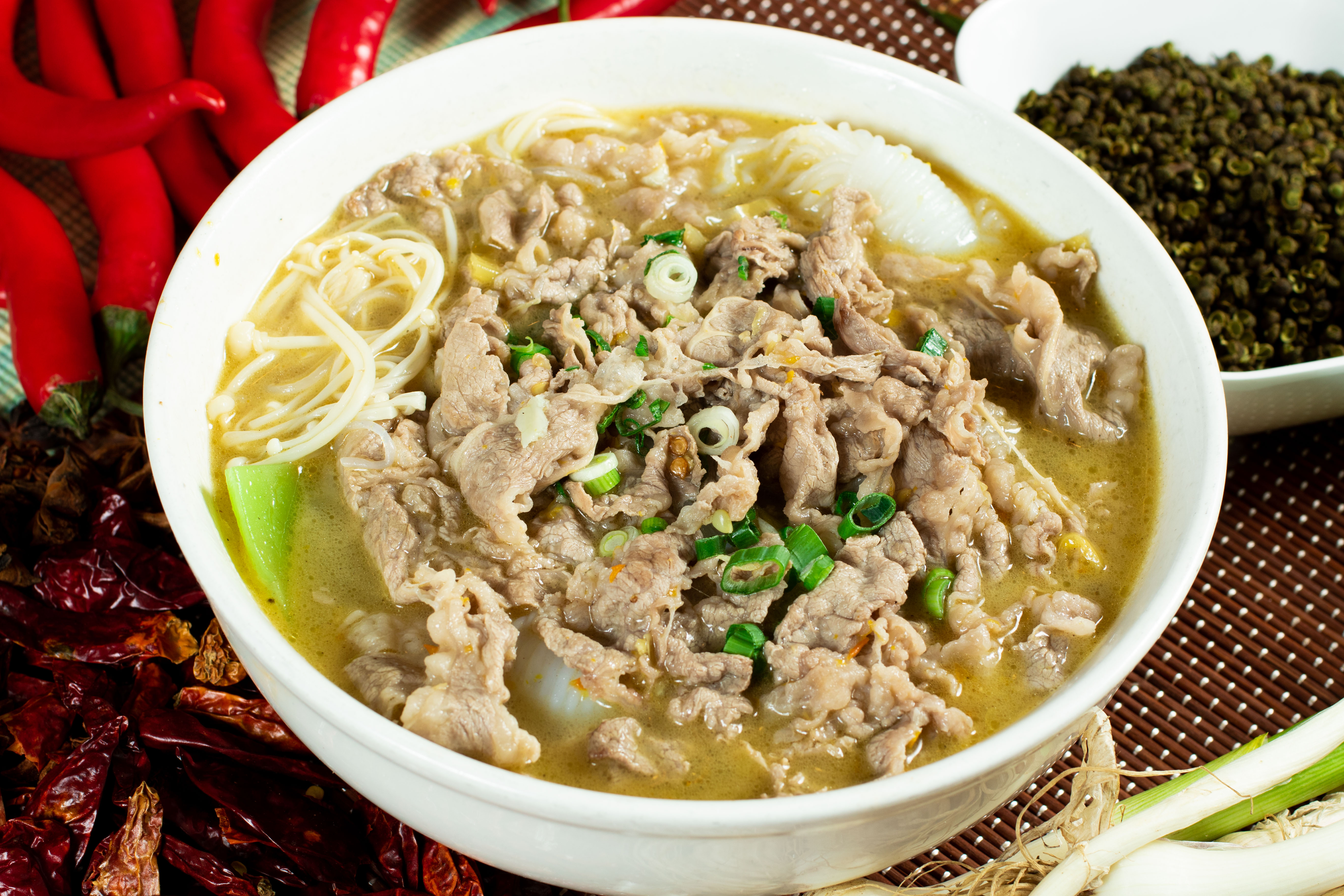 Order Sliced Beef in Spicy and Sour Broth food online from Sangkee Noodle House store, Philadelphia on bringmethat.com