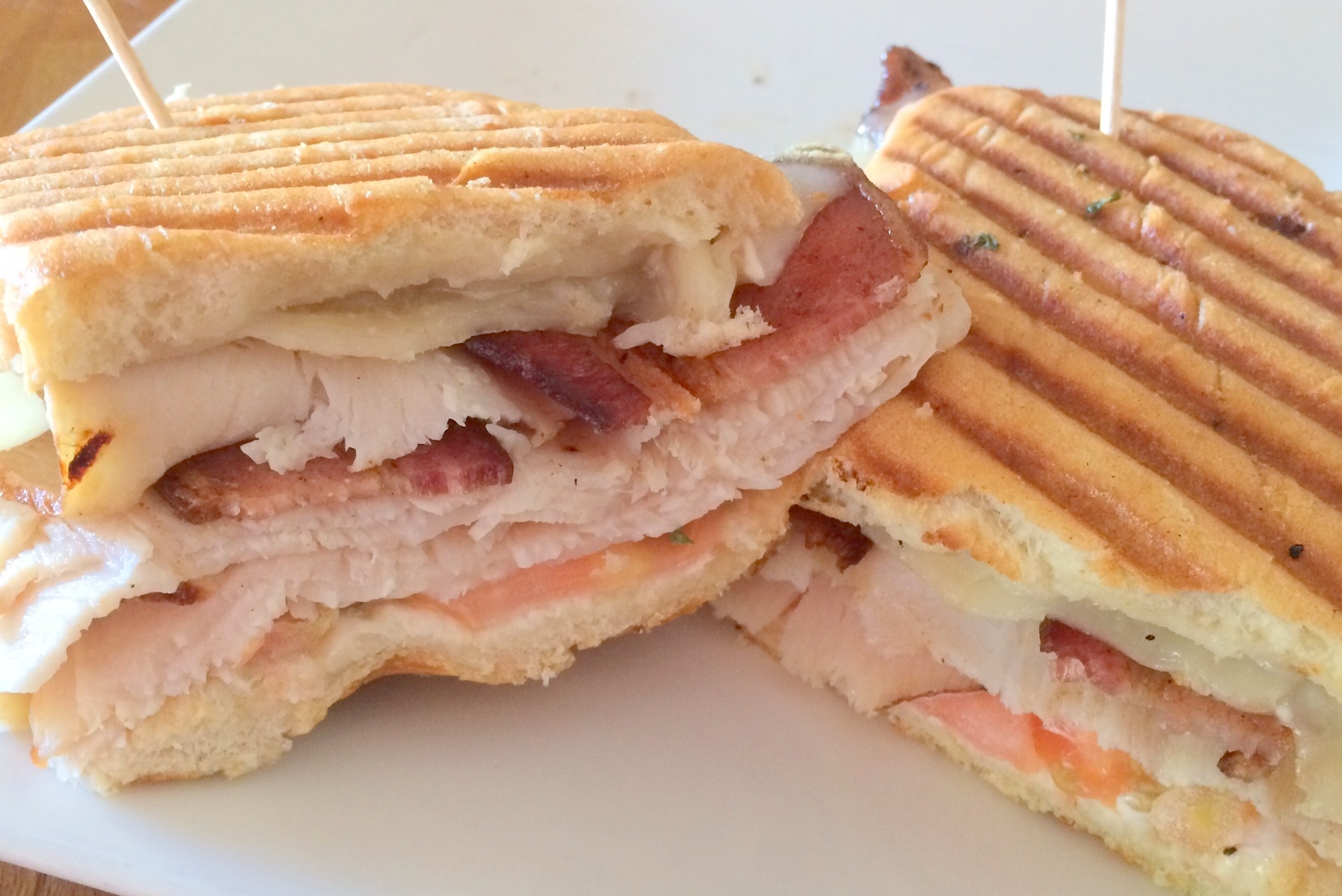 Order Turkey and Applewood Bacon Panini food online from Leaning Tower Pizza & Pasta store, Sherman Oaks on bringmethat.com