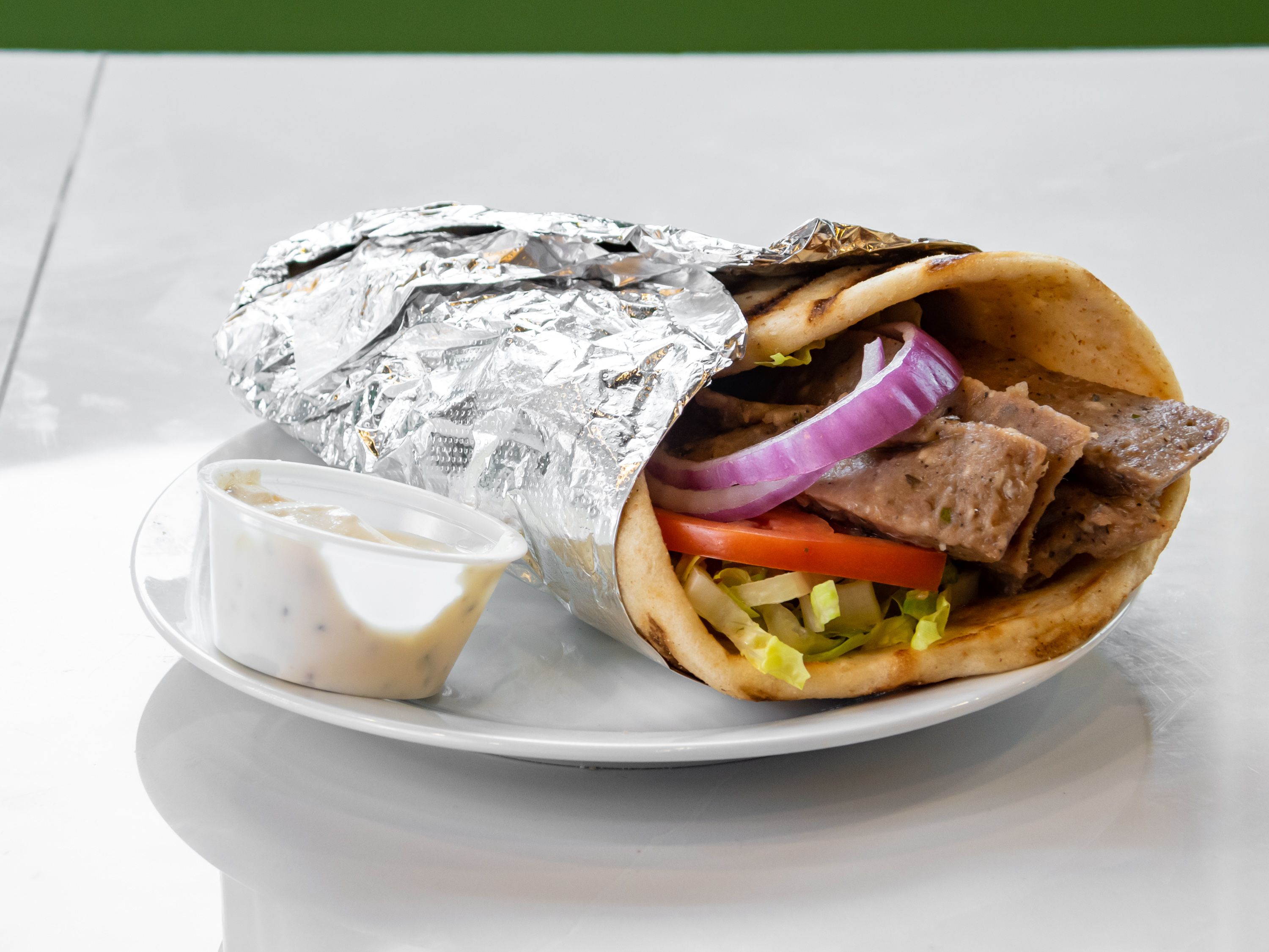 Order Beef Gyro food online from New Yorker Pizza store, Leesburg on bringmethat.com
