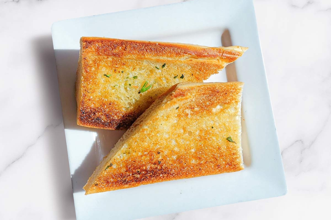 Order Single Side Garlic Bread food online from Cafe Express store, Houston on bringmethat.com