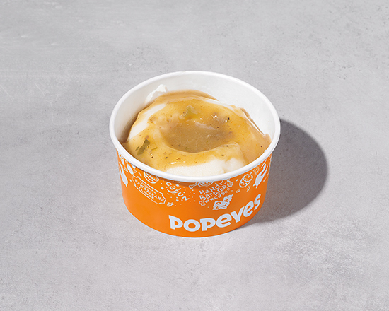 Order Regular Mashed Potatoes with Cajun Gravy food online from Popeyes store, Kansas City on bringmethat.com