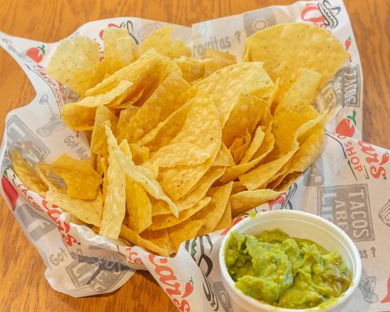 Order Guacamole and Chips (8 oz) food online from Oscar's Taco Shop store, Smyrna on bringmethat.com