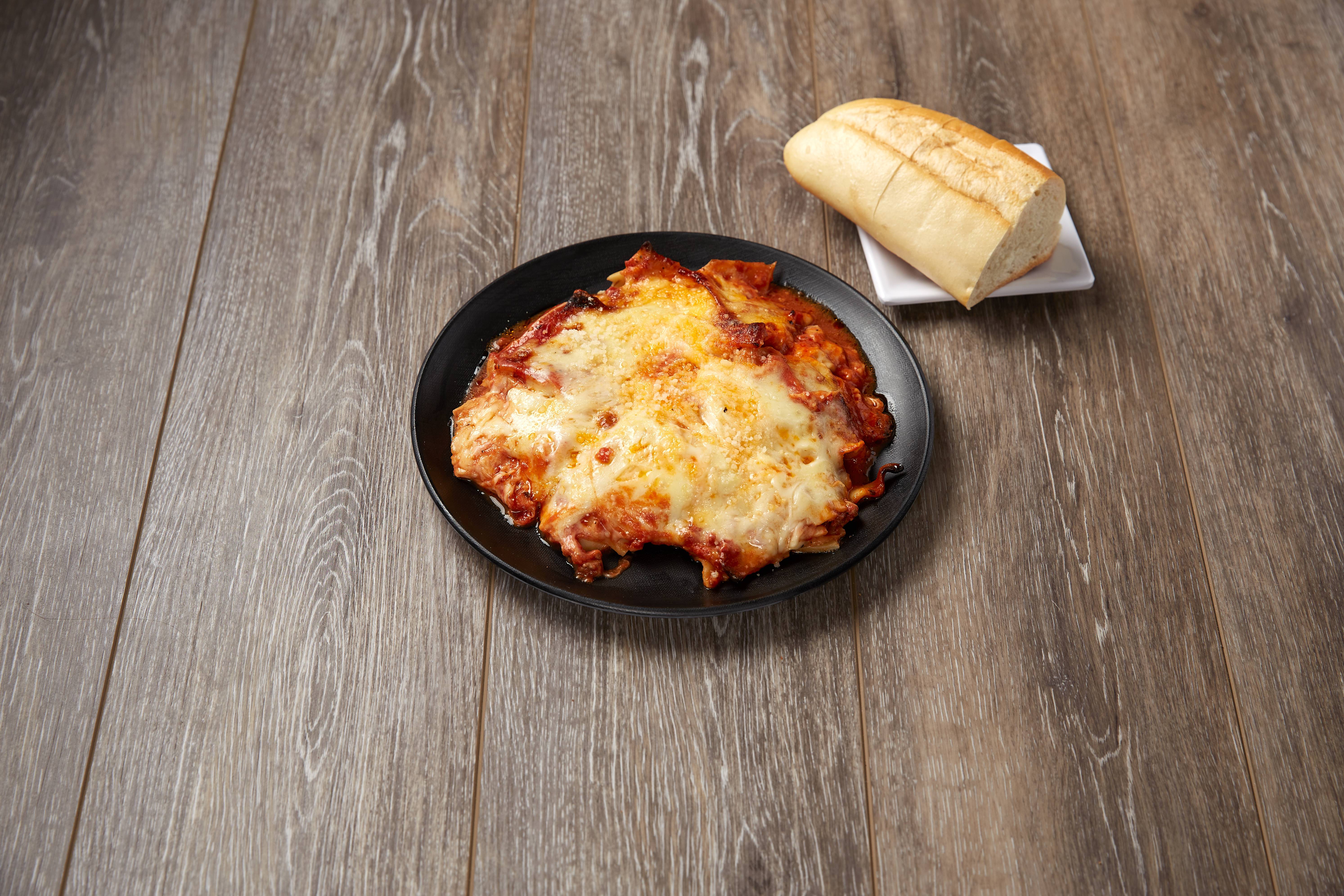 Order Lasagna food online from Mario's Pizzeria store, Brooklyn on bringmethat.com