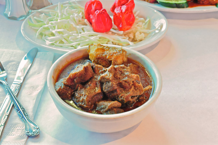 Order Curry Goat food online from Nest Restaurant & Bar store, Richmond Hill on bringmethat.com