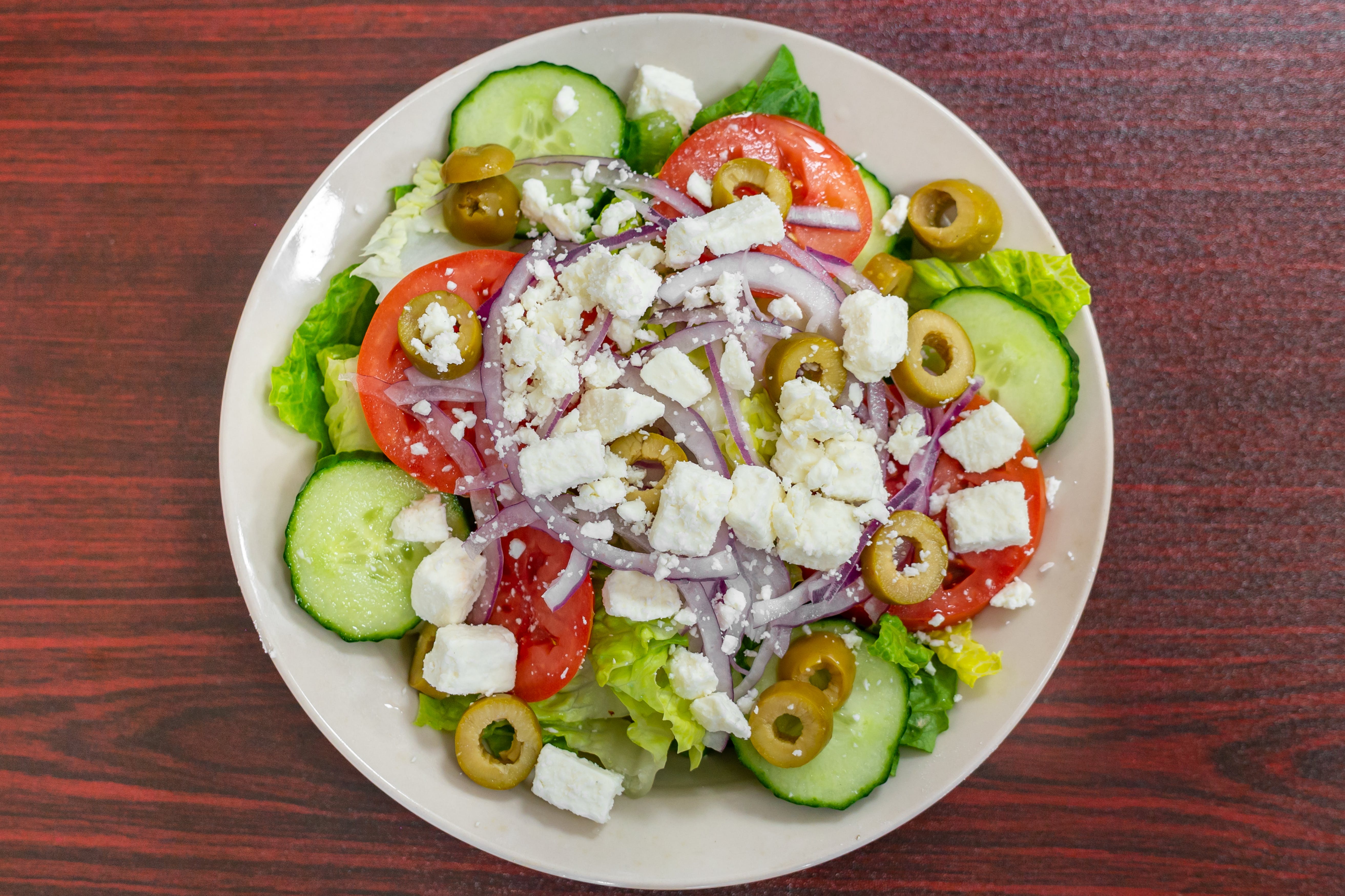 Order Greek Salad - Salad food online from Bella Roma Pizza store, Livermore on bringmethat.com