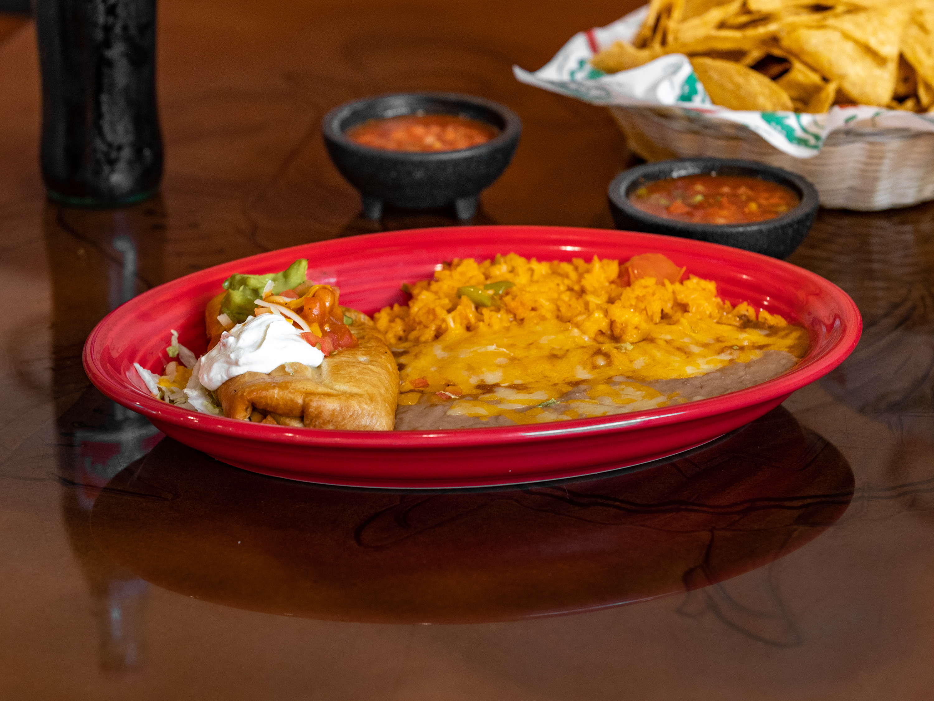 Order #8. Enchilada and Chimichanga Combo food online from Mi Tierra Family Mexican Restaurant store, Lincoln on bringmethat.com