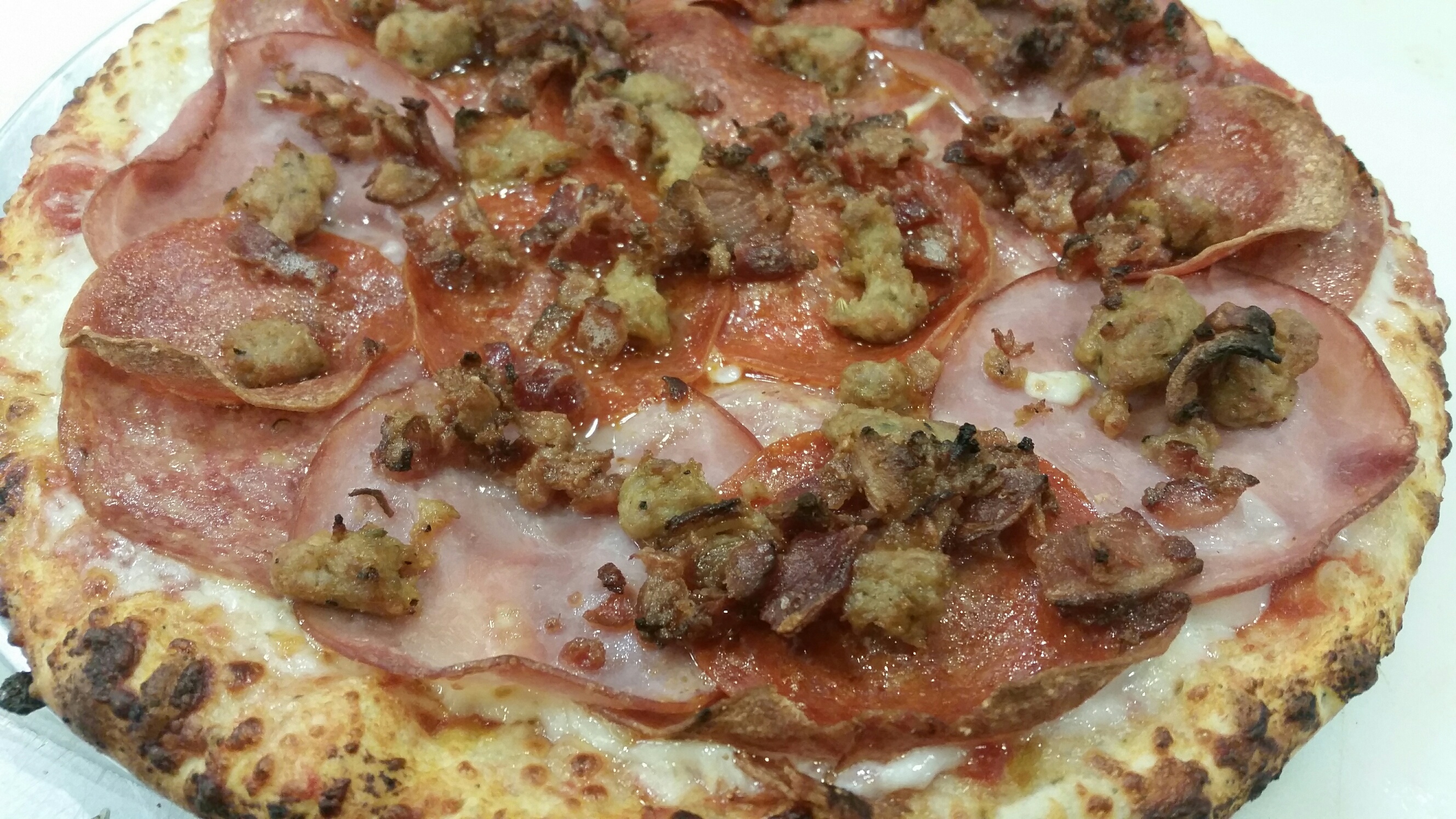 Order Meat, Meat and More Meat Pizza food online from Pizanos Pizza store, Reno on bringmethat.com