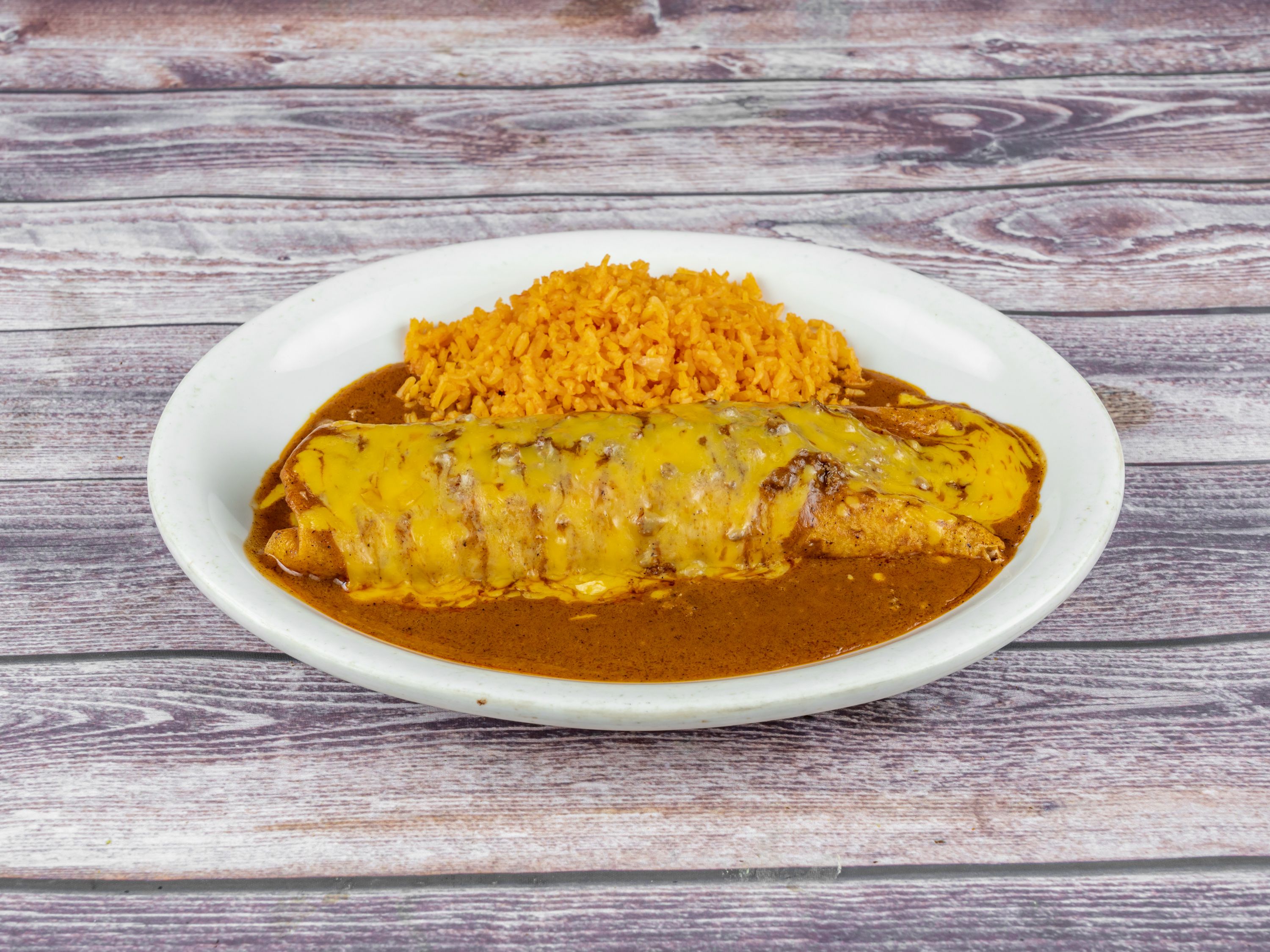 Order Giant Burrito food online from Tequila Lopez Mexican Restaurant store, Houston on bringmethat.com