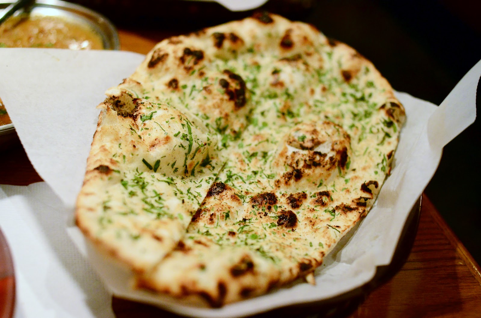 Order Garlic Naan food online from India's Grill store, Los Angeles on bringmethat.com