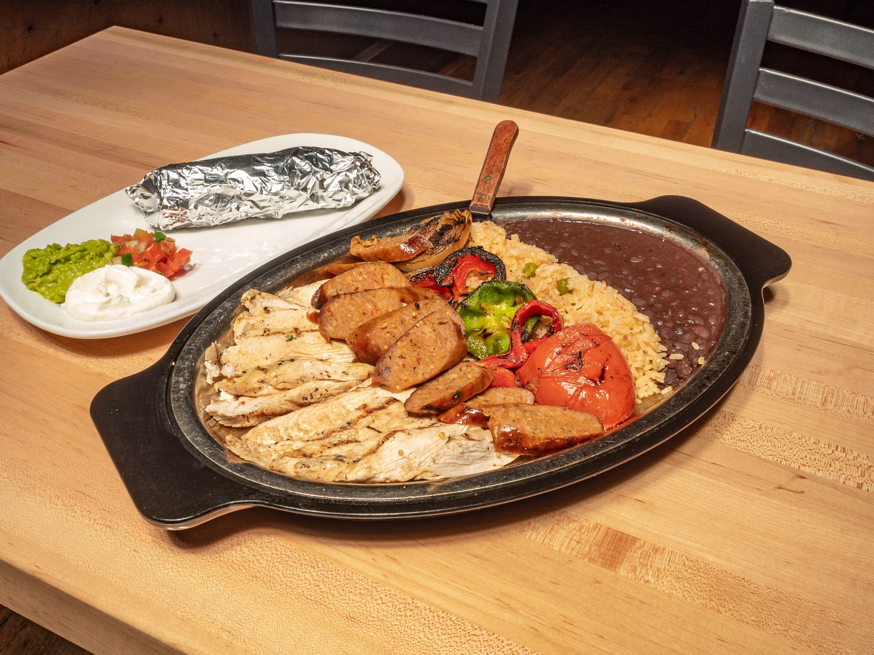 Order Chicken and Texas Sausage Fajita Combo food online from The Rio Grande Mexican Restaurant store, Lone Tree on bringmethat.com