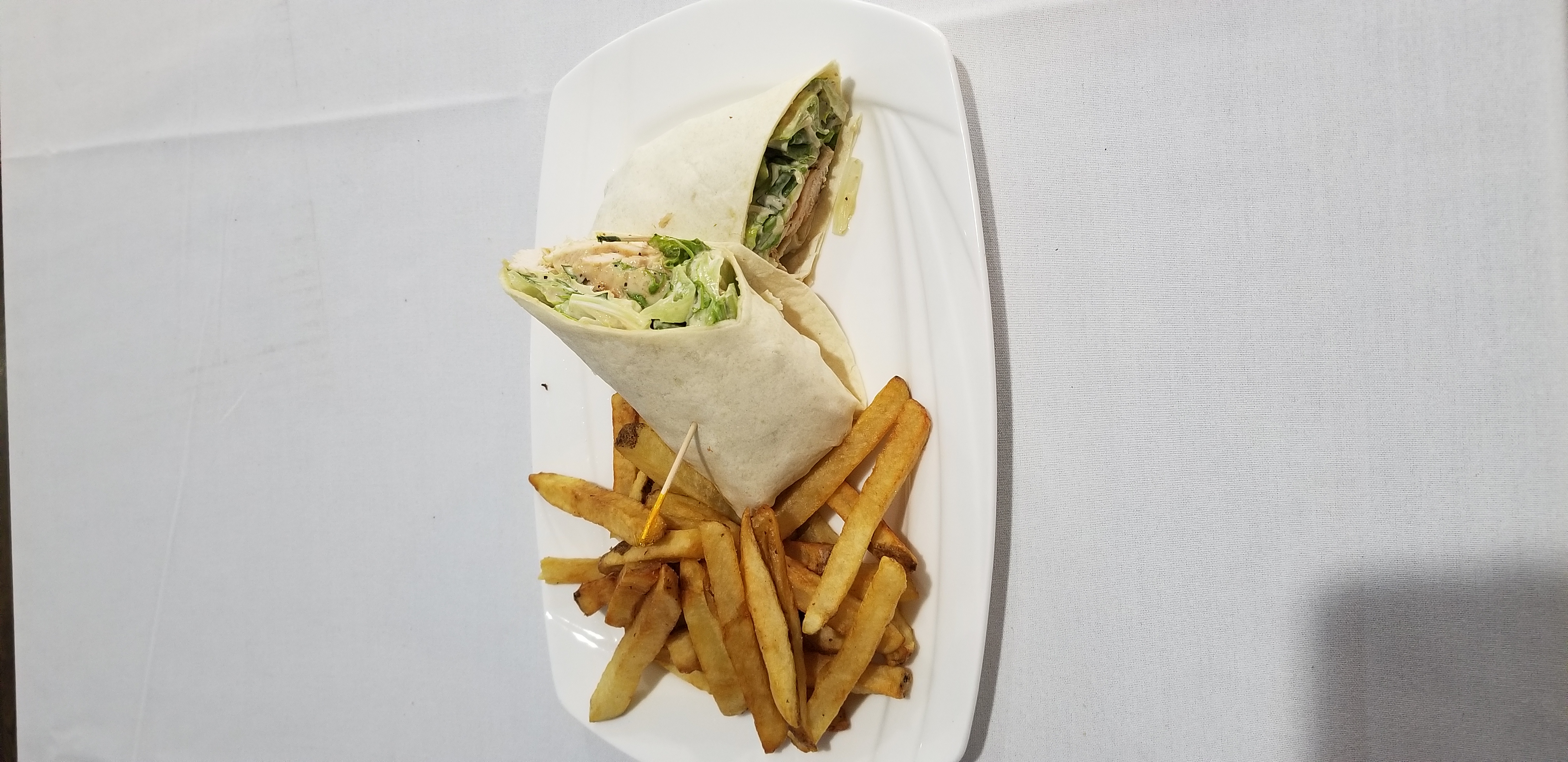 Order Grilled Chicken Caesar Wrap food online from Downey's Bar & Grill store, Bronx on bringmethat.com