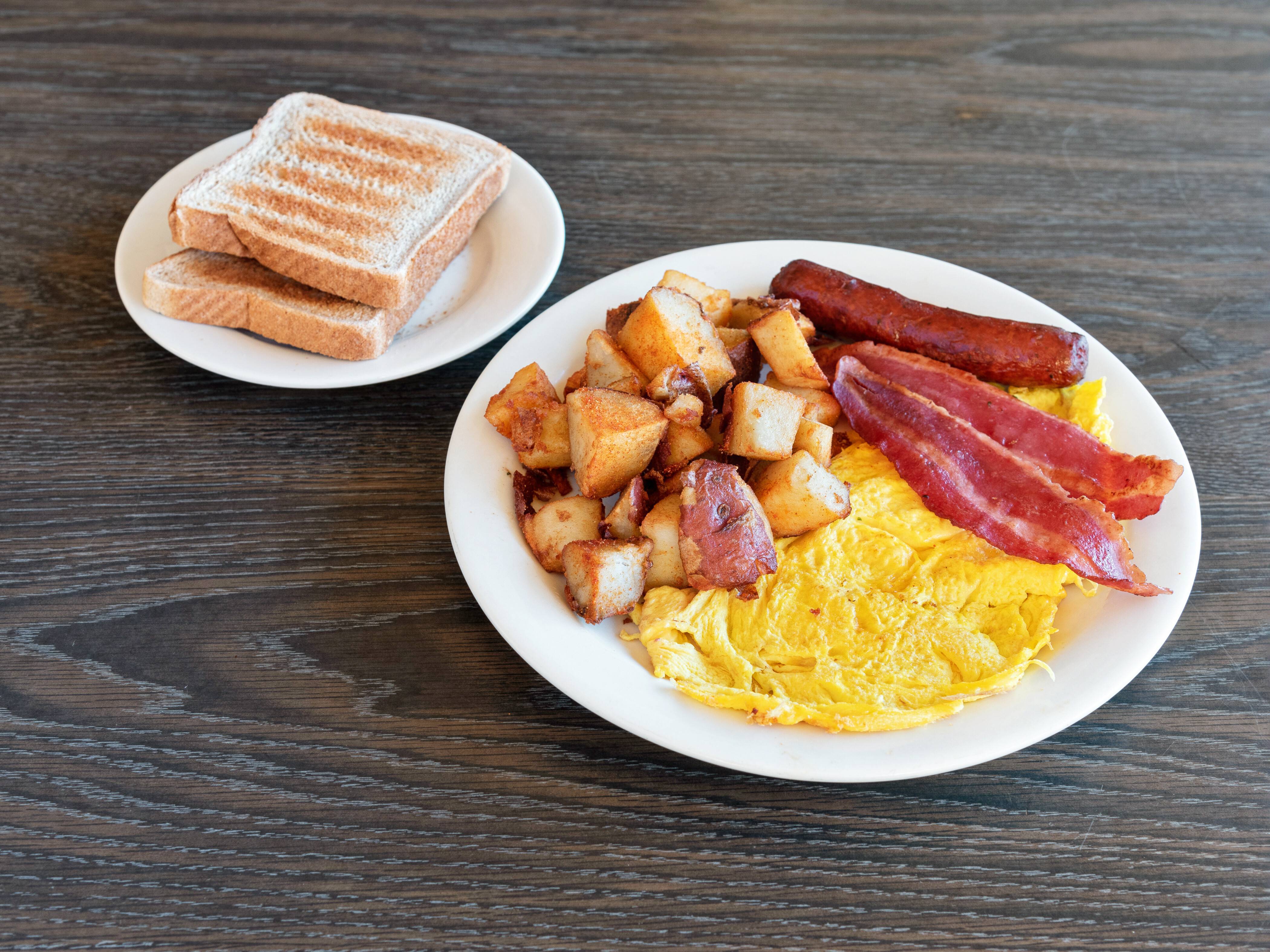 Order #25. 2 Eggs 1 Beef Sausage 2 bacon homefries or grits with Toast  food online from Brothers deli restaurant store, Mattapan on bringmethat.com